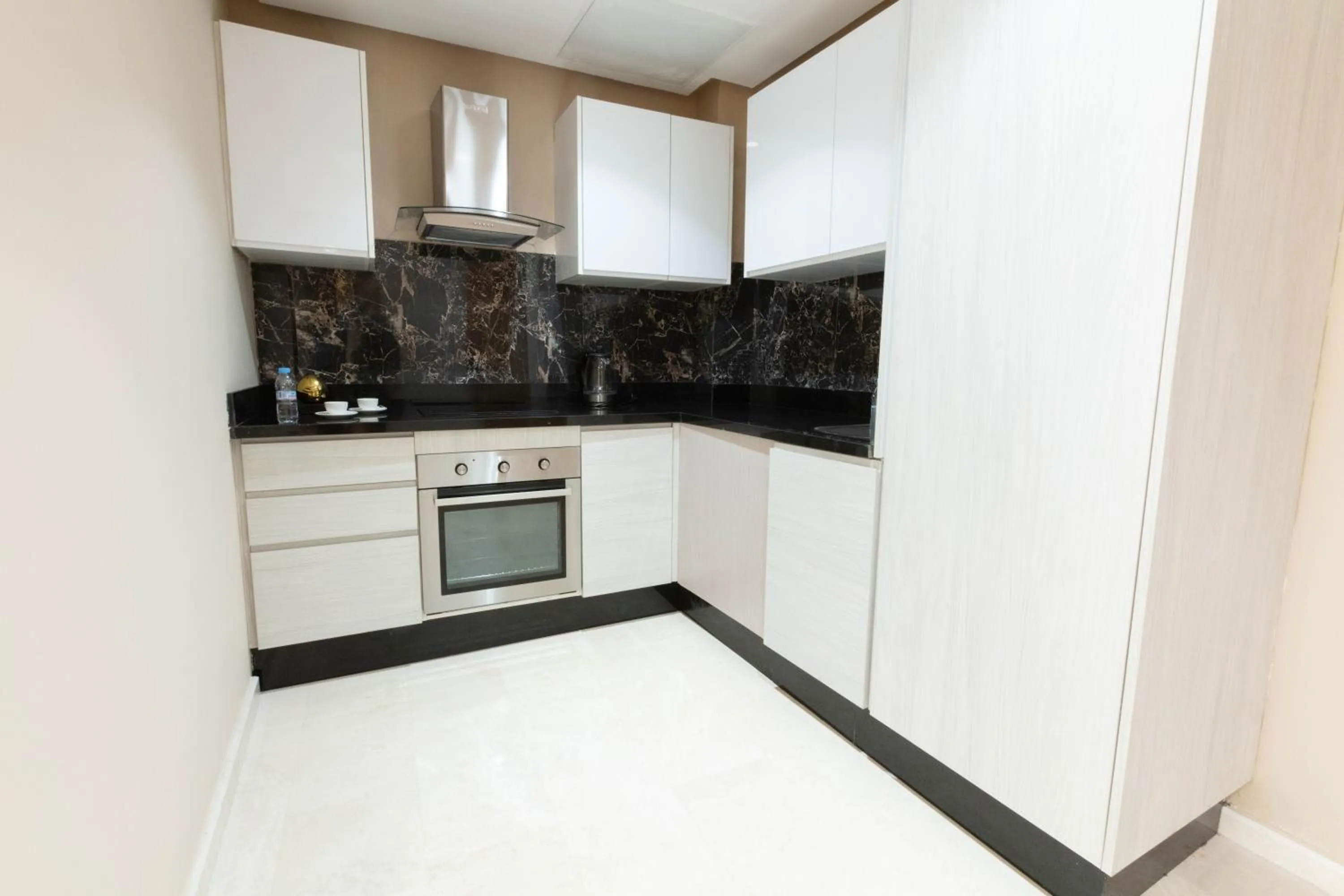 Kitchen or kitchenette in ZEN Suites Hotel Massira