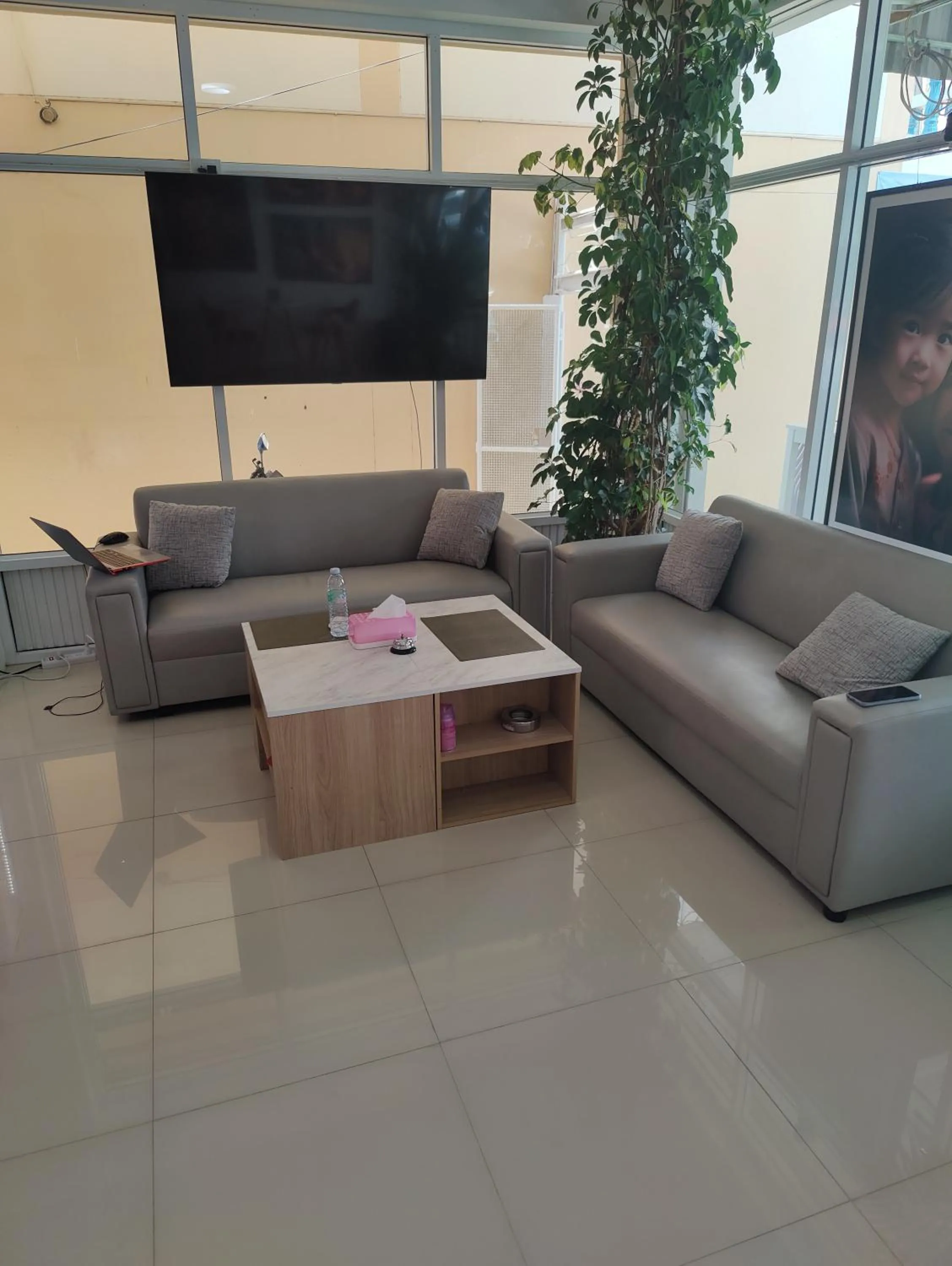 Communal lounge/ TV room in Cafe Nana Hotel