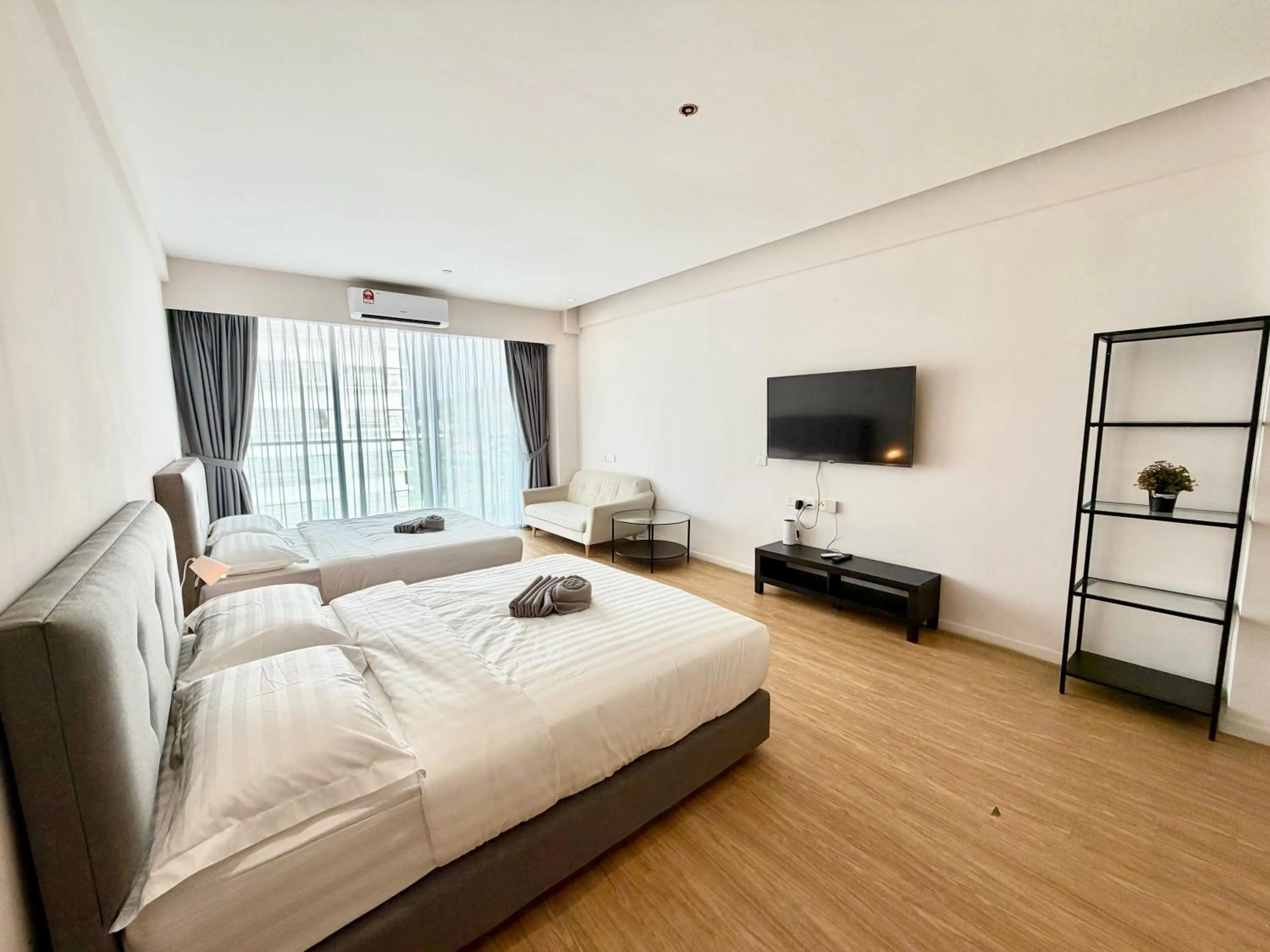 Living room, Bed in Deco Home @ Aru Suites