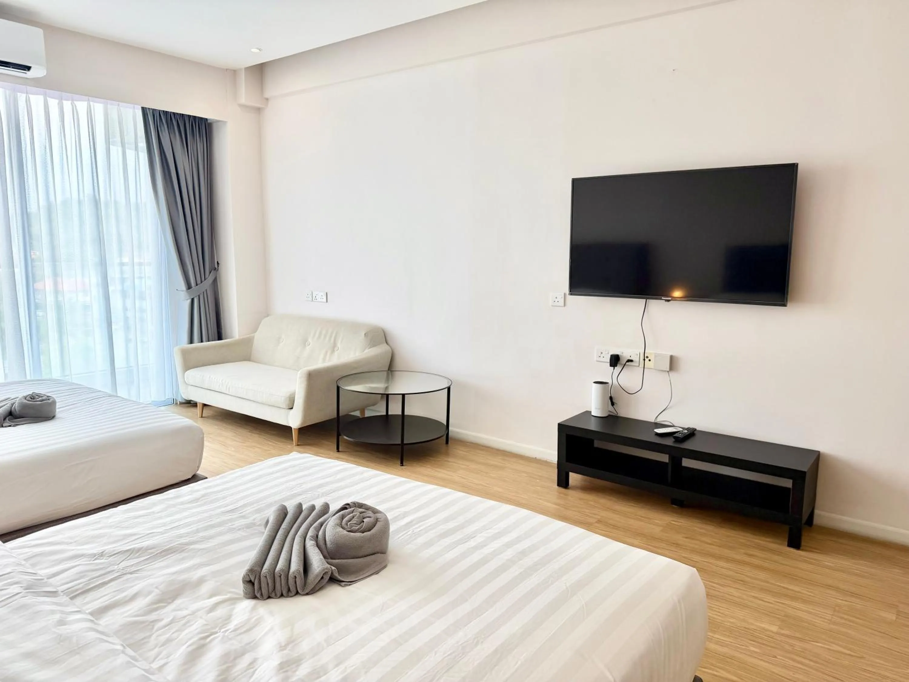 Living room, Bed in Deco Home @ Aru Suites