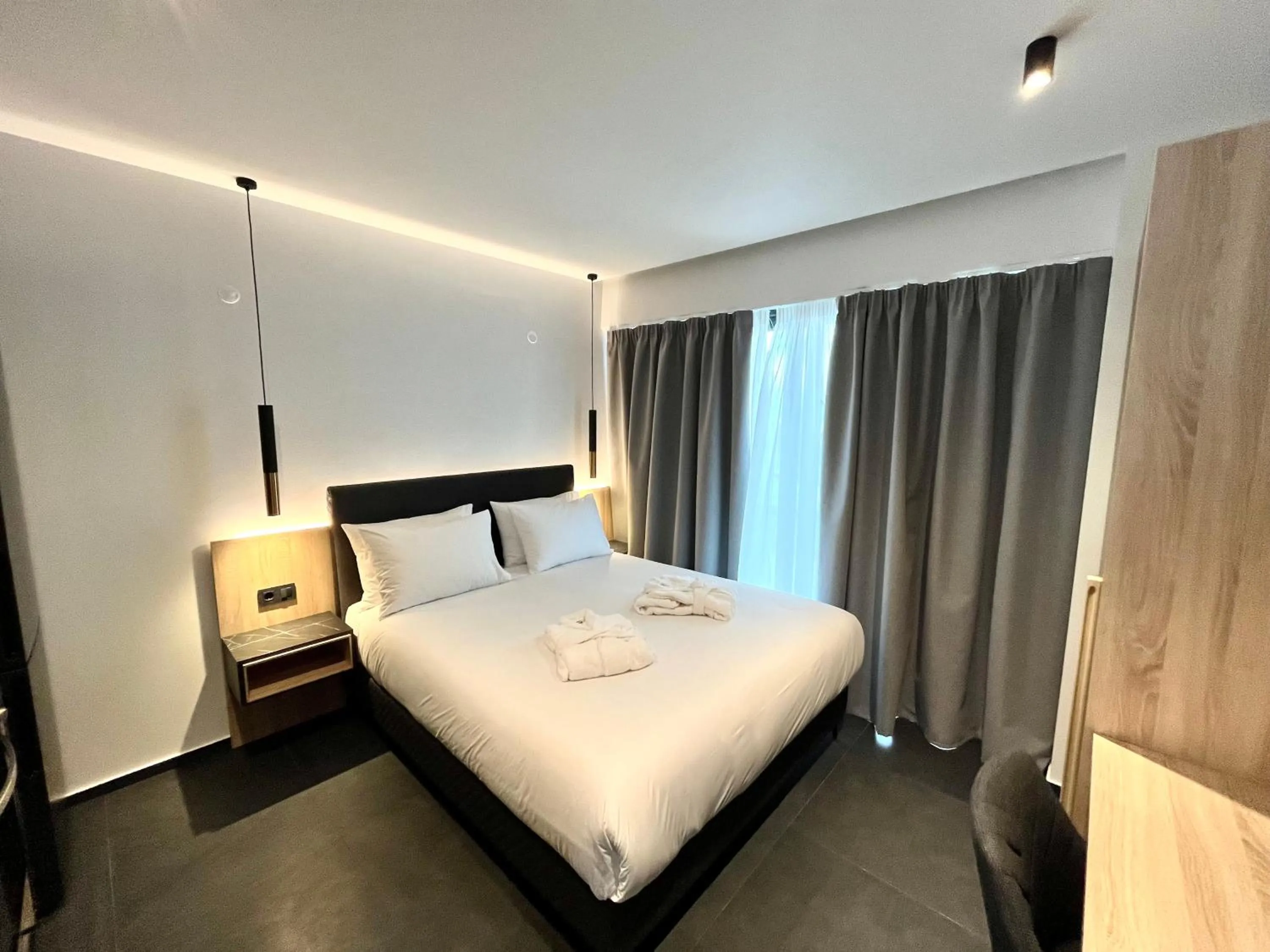 Bed in CITY HILL Luxury Apartments