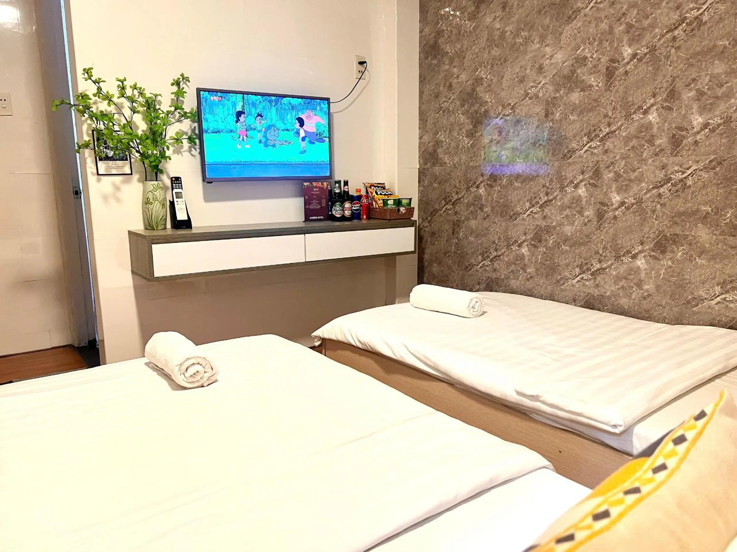 Bed in Jasmine Hotel