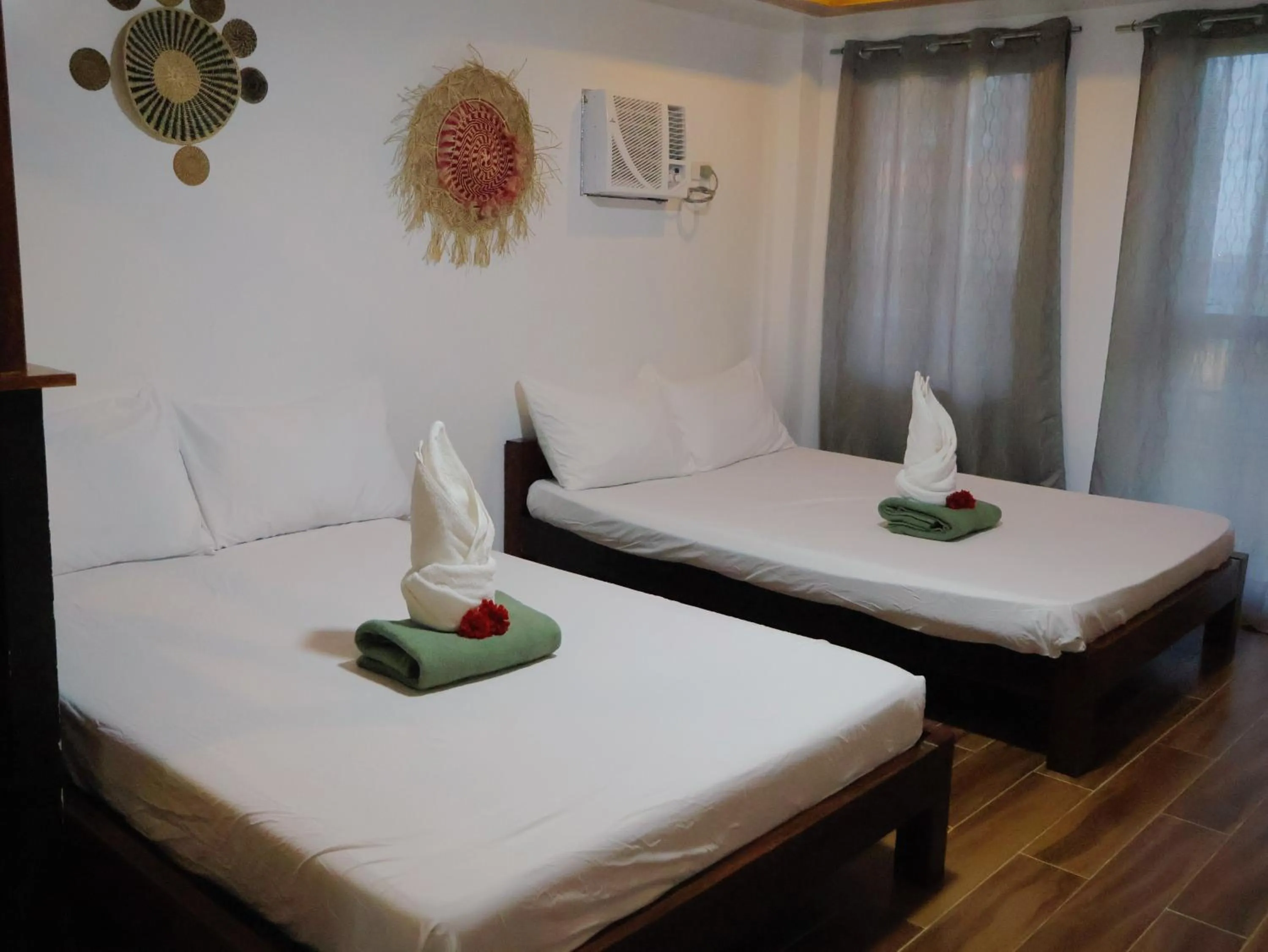 Bed in LANGOJON JIANJOY BEACH RESORT