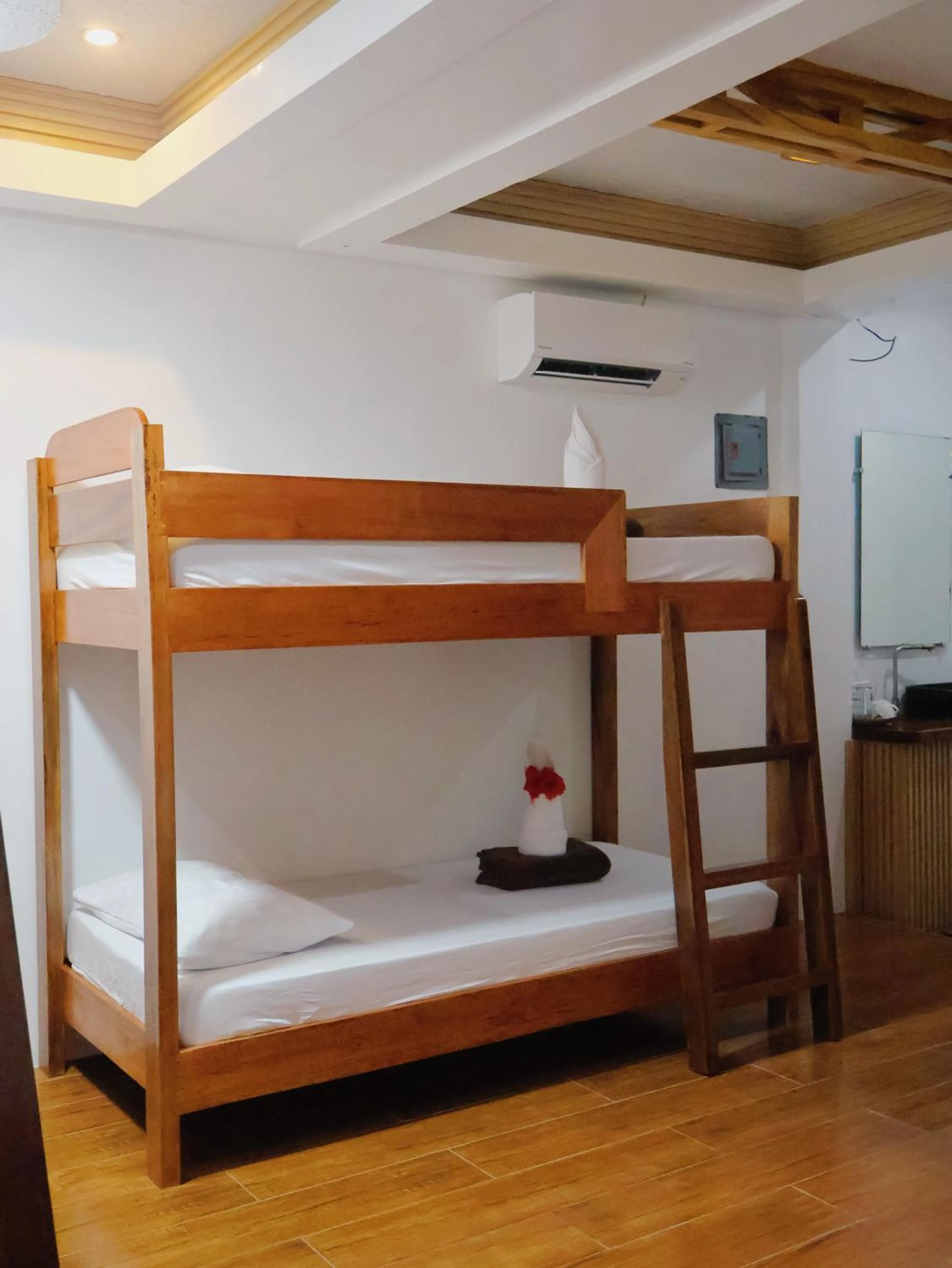 Bed in LANGOJON JIANJOY BEACH RESORT