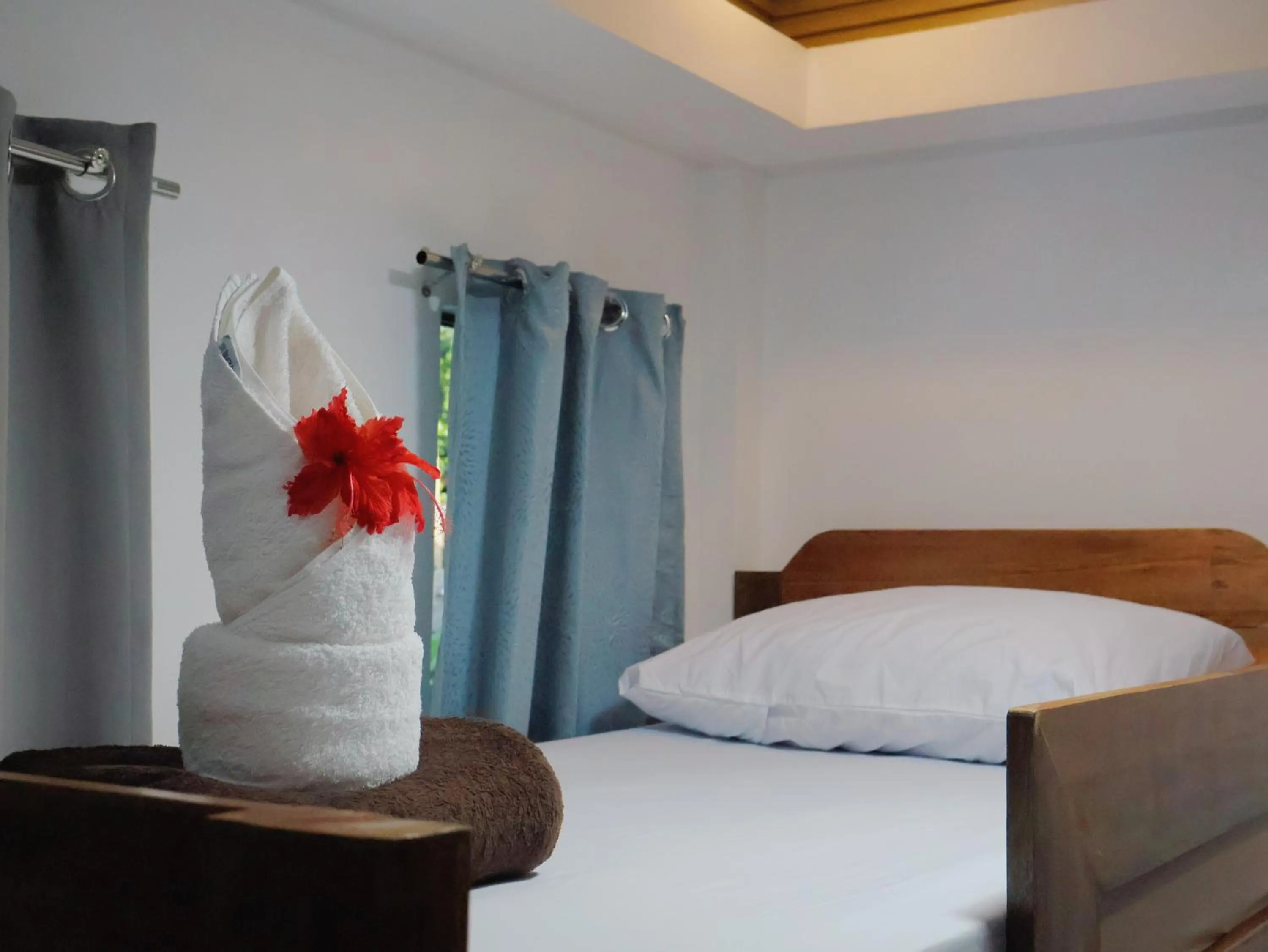 Bed in LANGOJON JIANJOY BEACH RESORT