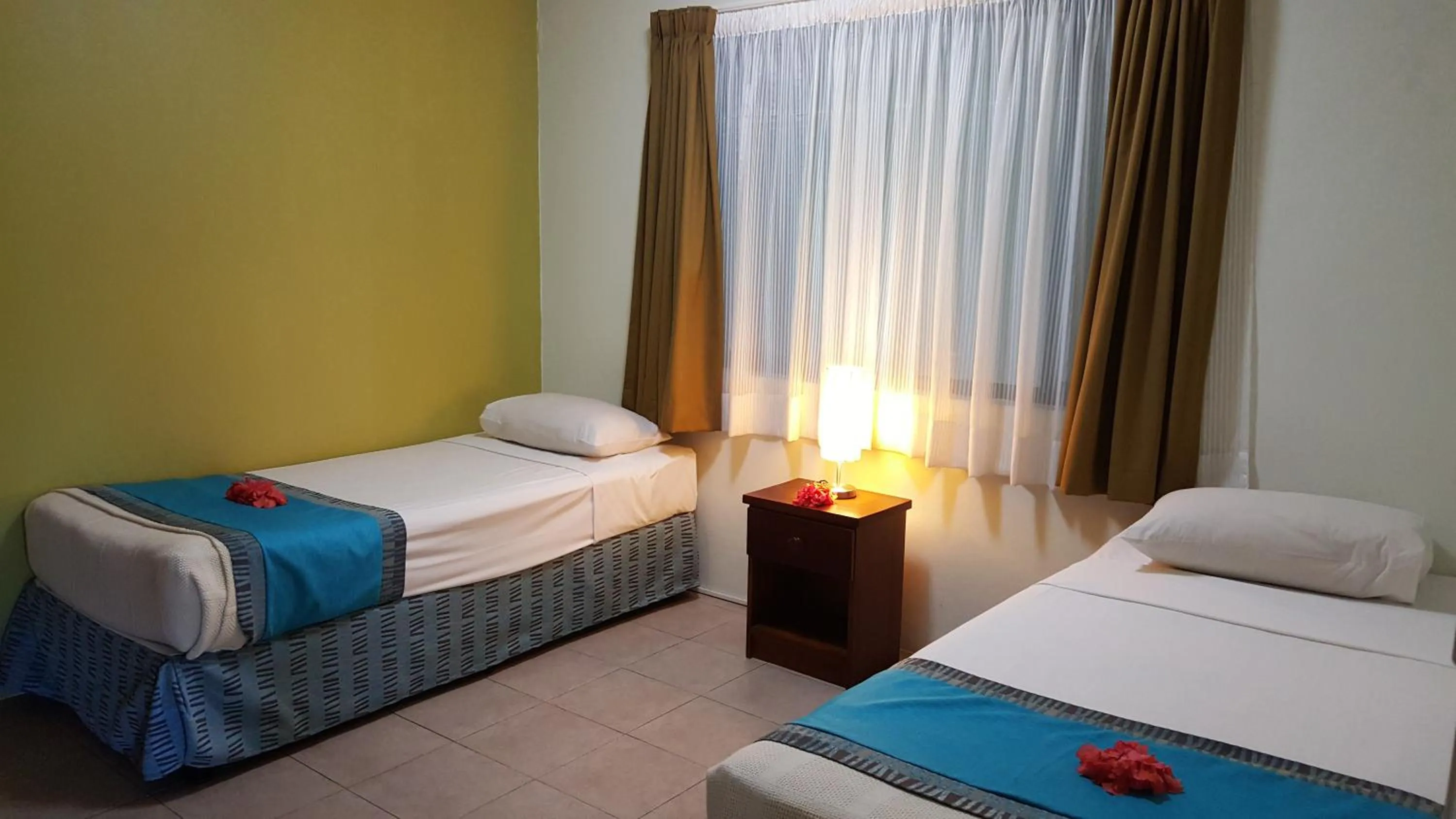Bed in Hexagon International Hotel, Villas & Spa