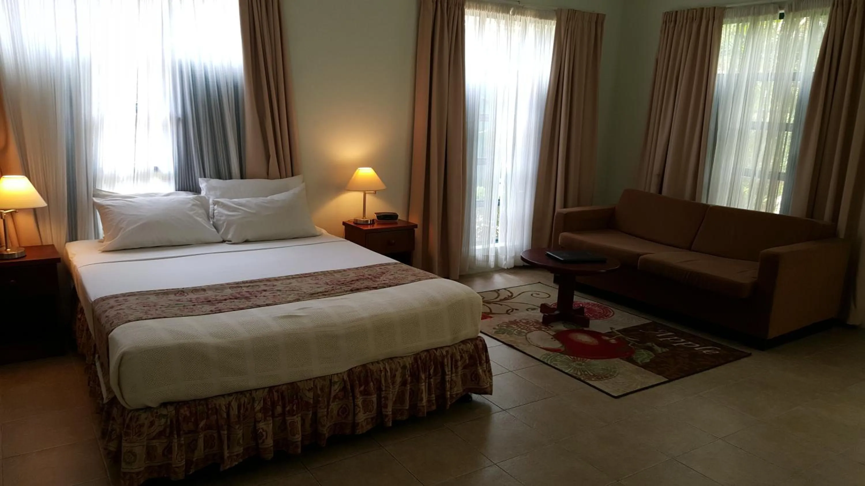 Bed in Hexagon International Hotel, Villas & Spa