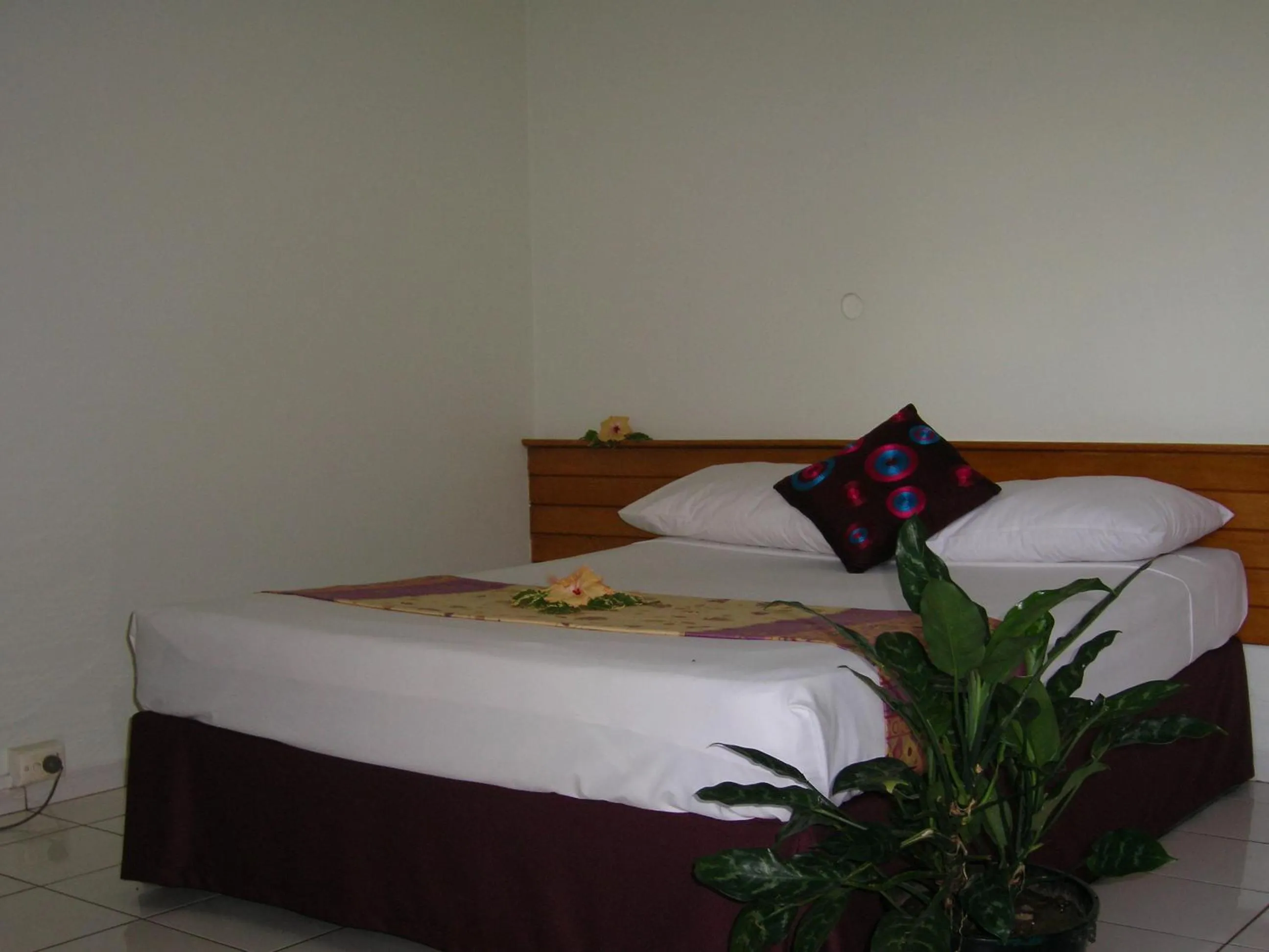 Bed in Hexagon International Hotel, Villas & Spa