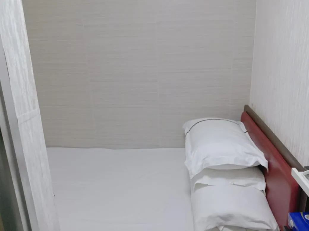 Bed in 富都賓館 Fu Dou Guest House