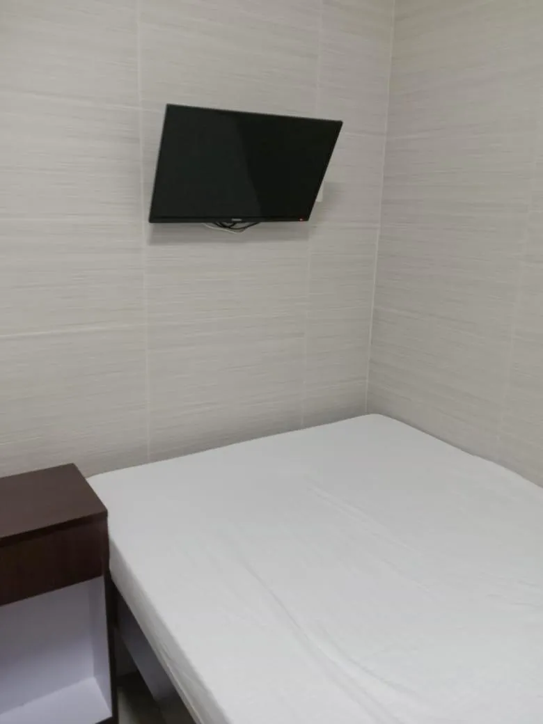 Bed in 富都賓館 Fu Dou Guest House