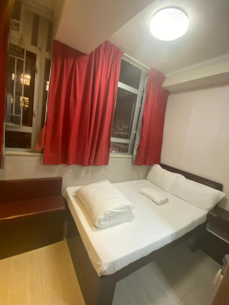 Bed in 富都賓館 Fu Dou Guest House