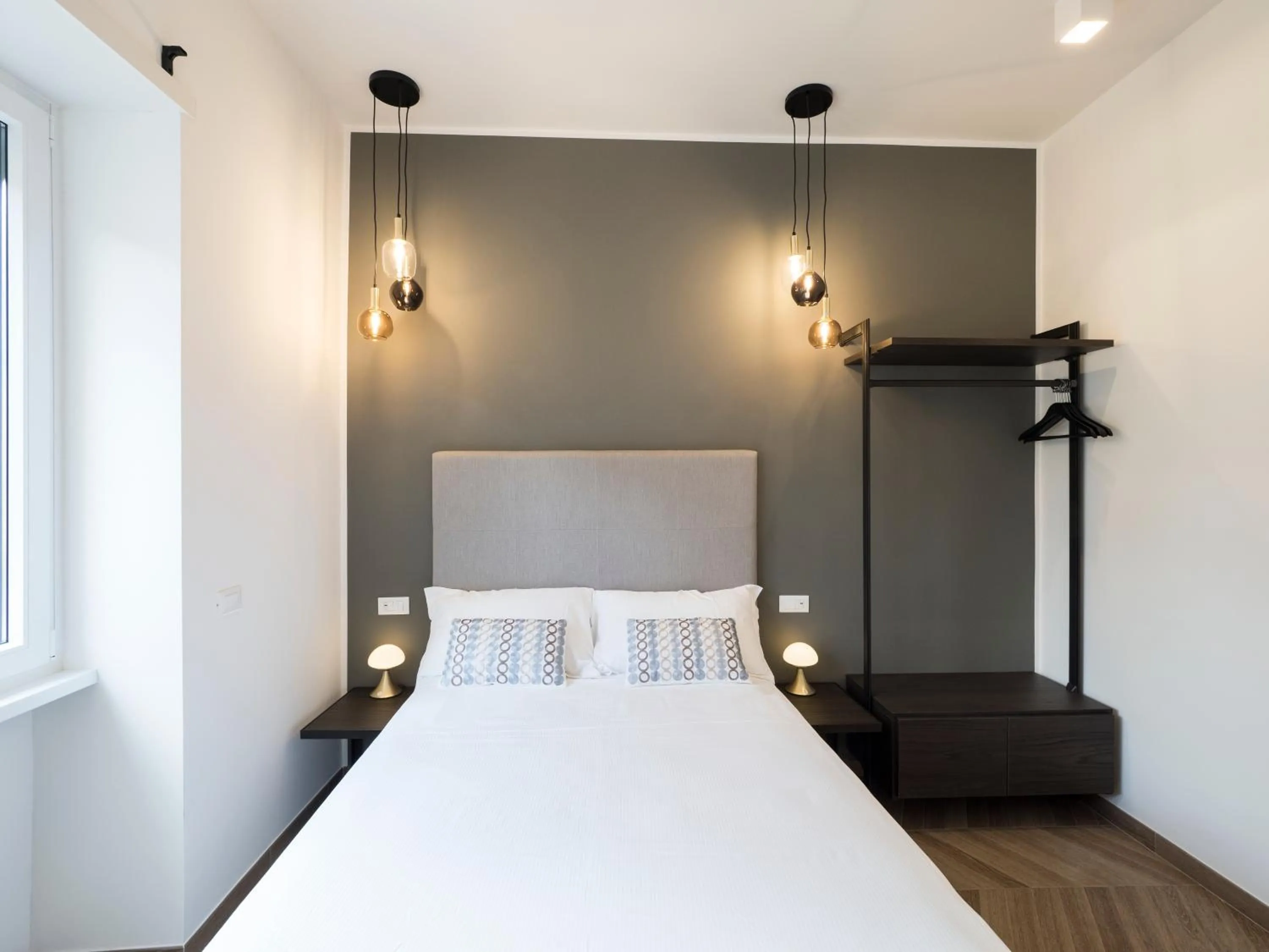 Bed in Savoia Rooms Roma