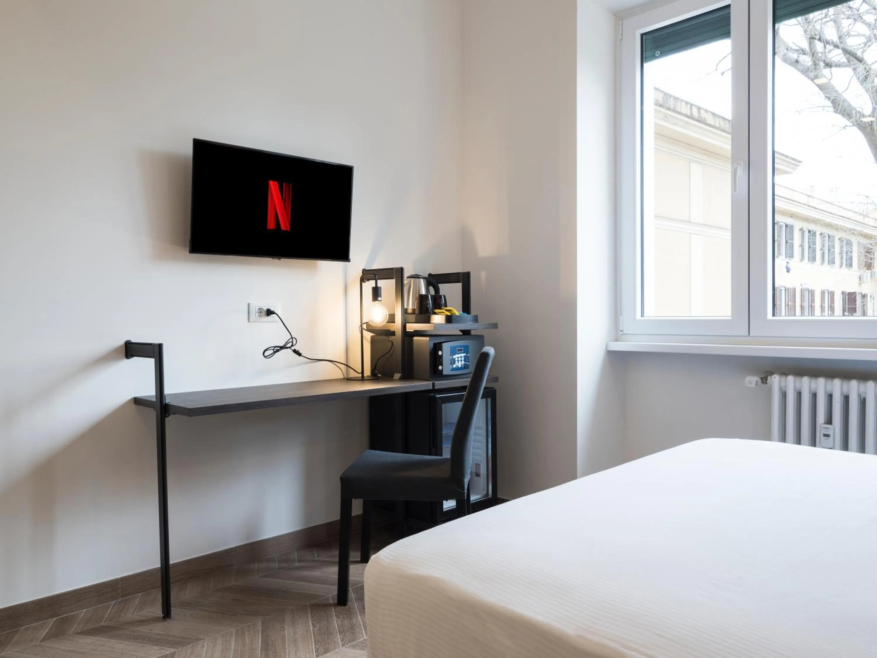 Bed in Savoia Rooms Roma