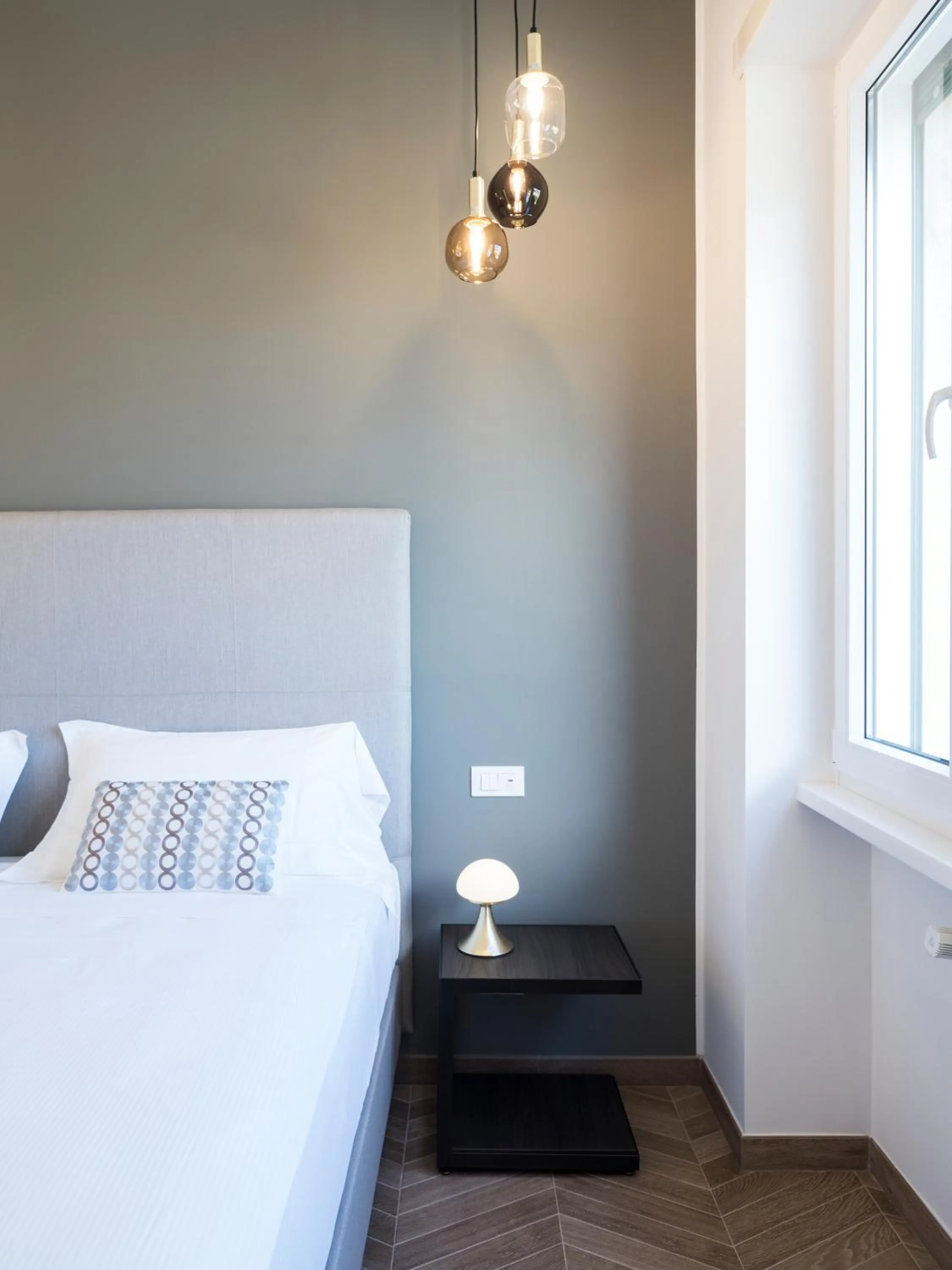 Bed in Savoia Rooms Roma