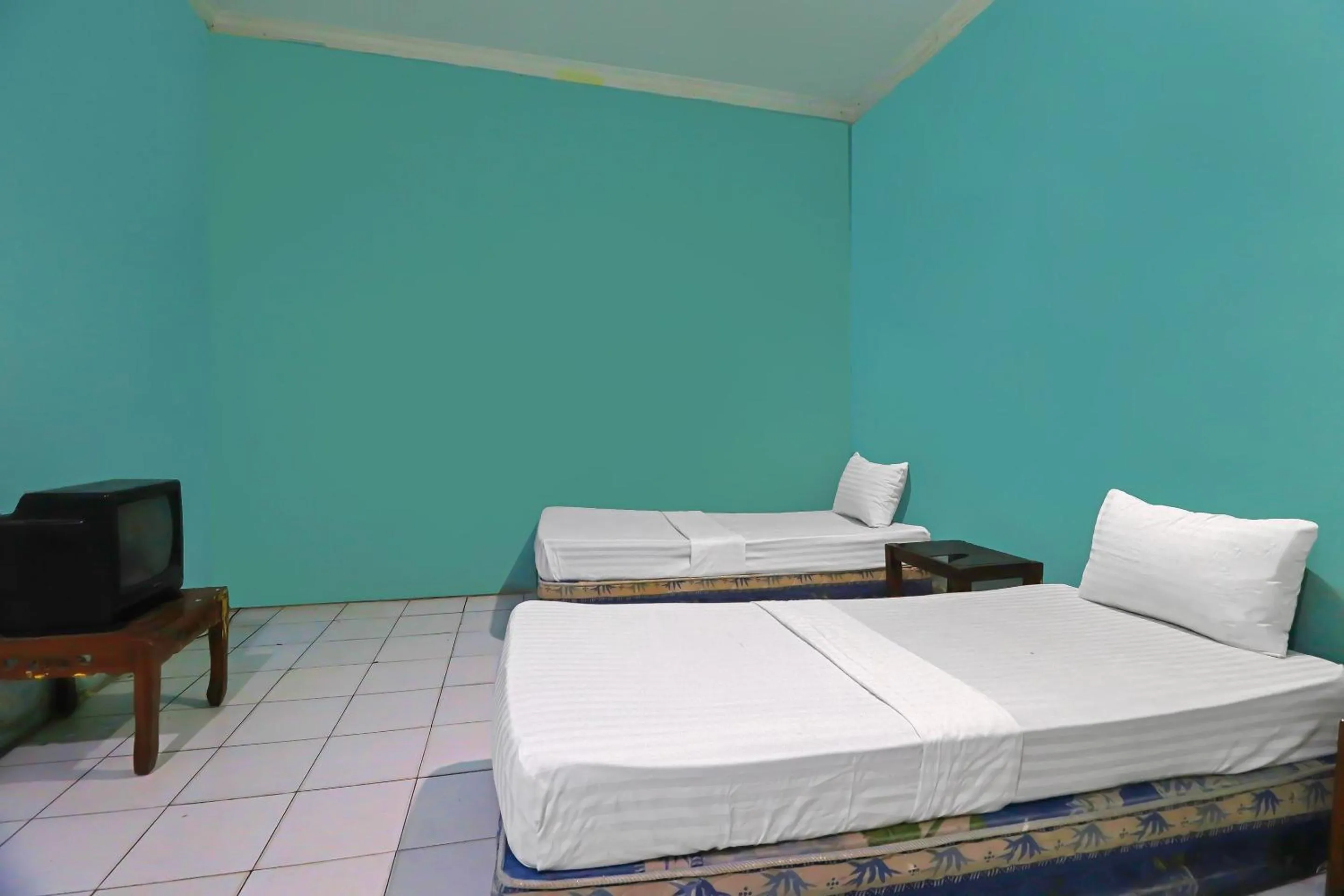 Bedroom in Hotel O Wisma Permata Syariah