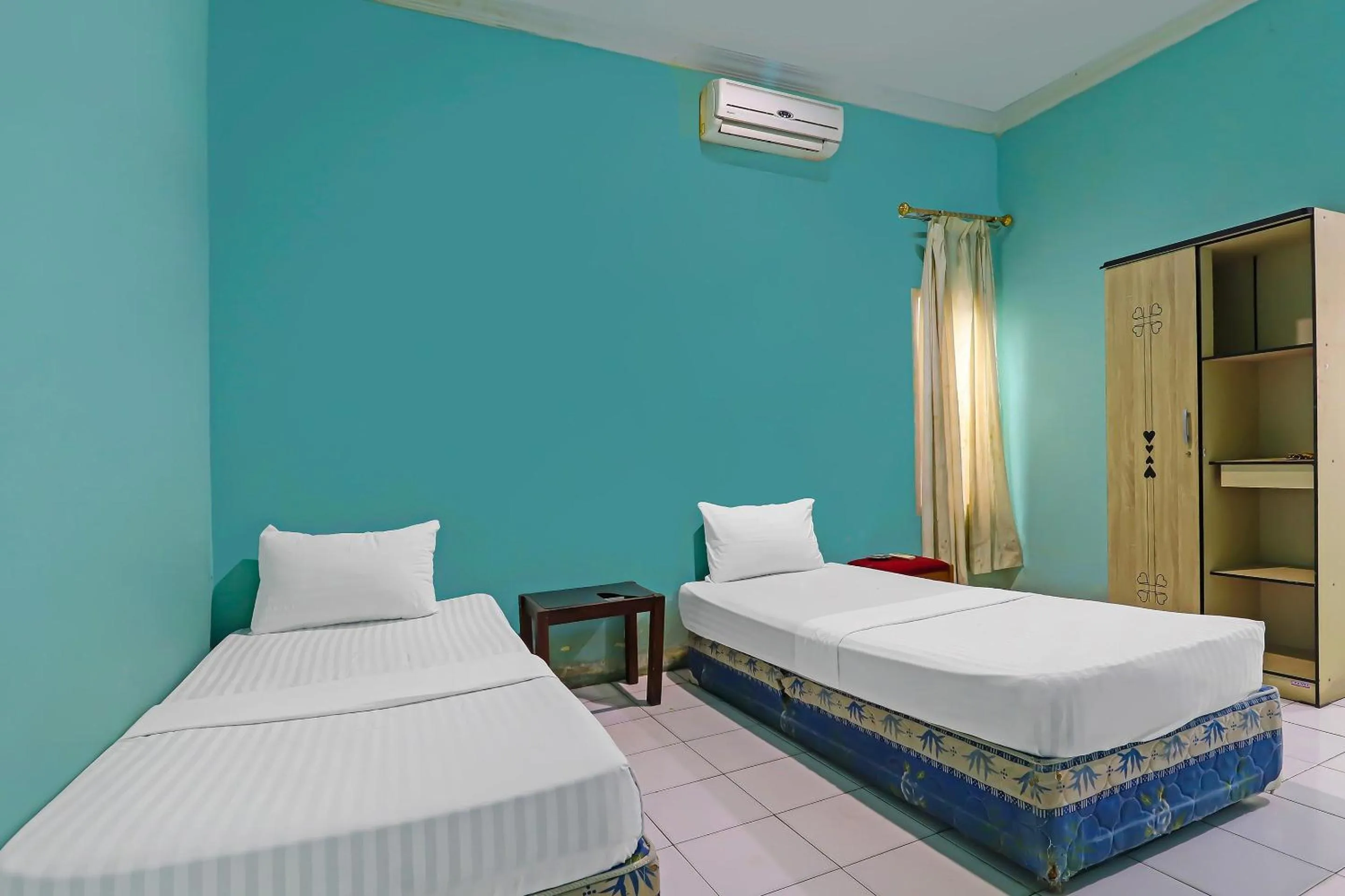Bedroom in Hotel O Wisma Permata Syariah