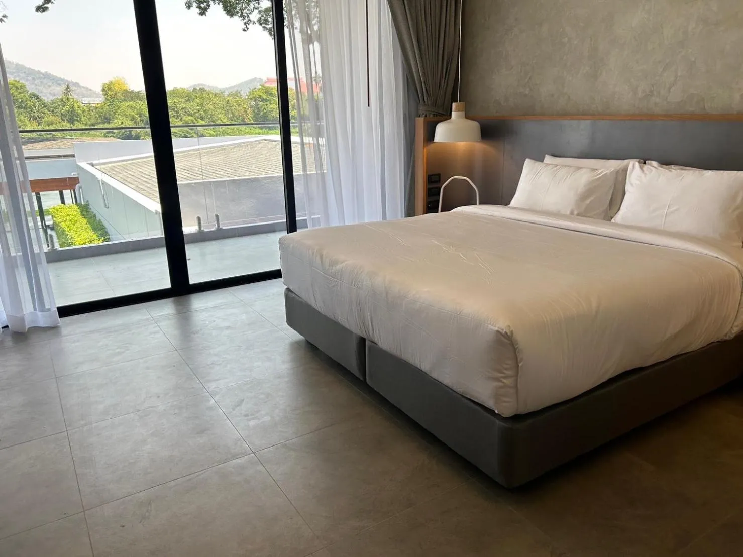 Photo of the whole room, Bed in Raintree Boutique