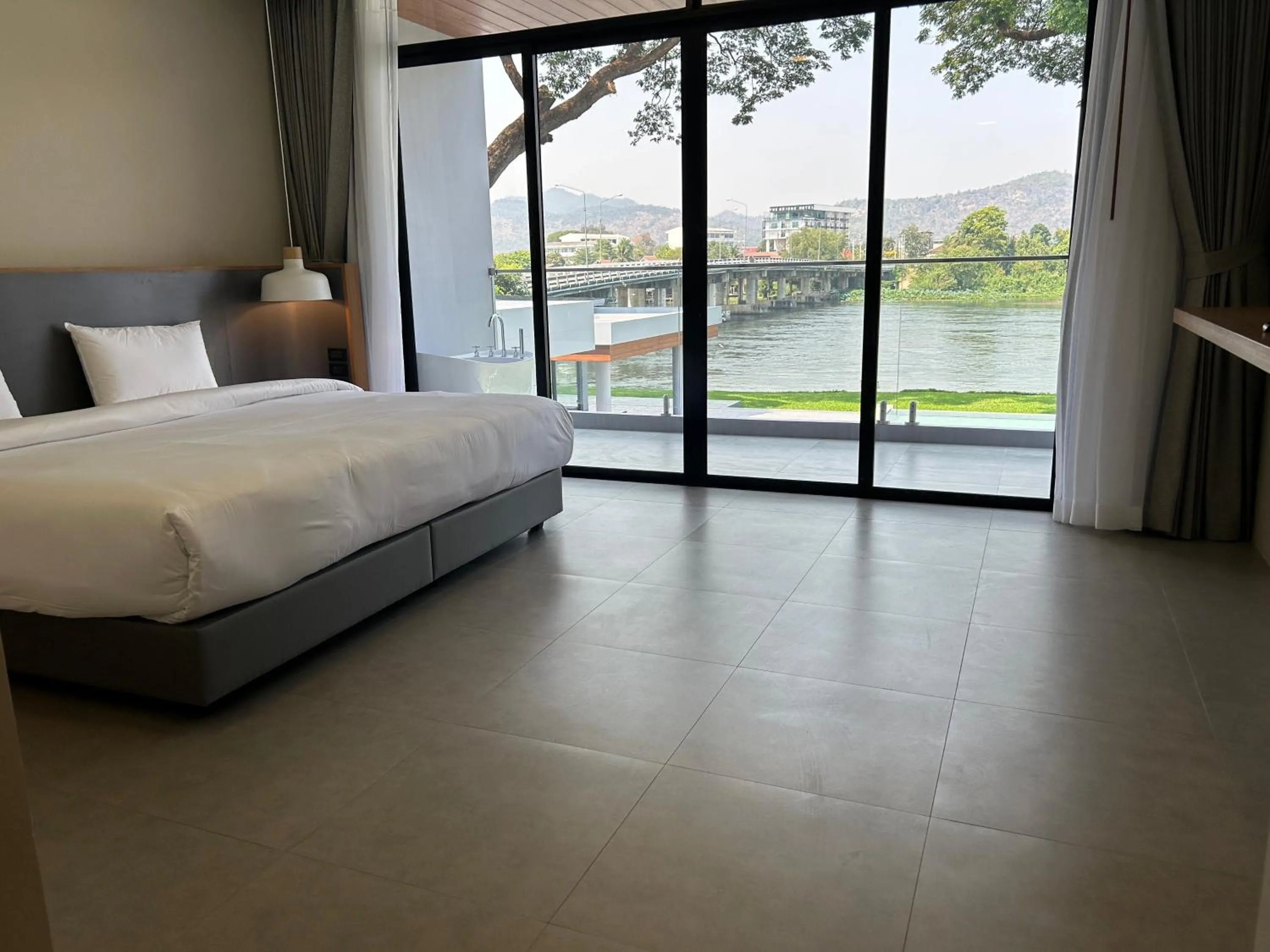 Photo of the whole room, Bed in Raintree Boutique