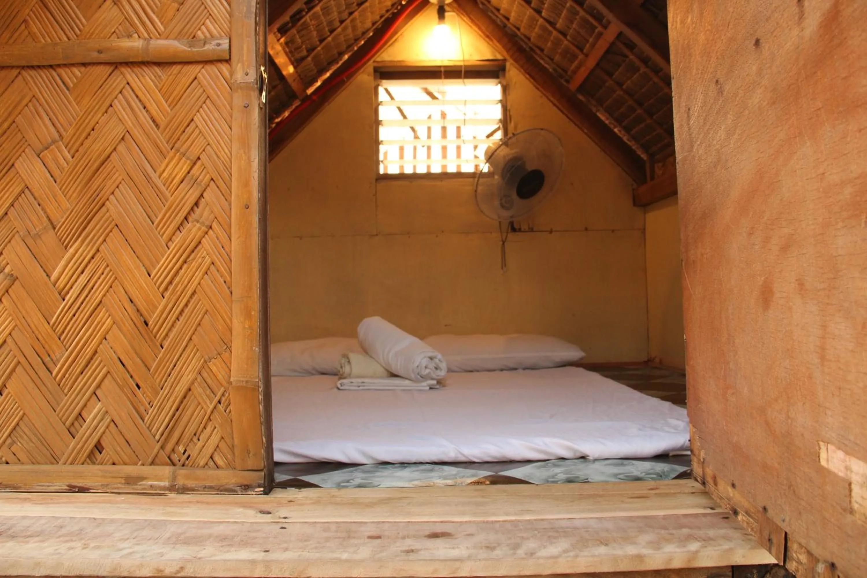 Bed in Good Guys Beach Resort