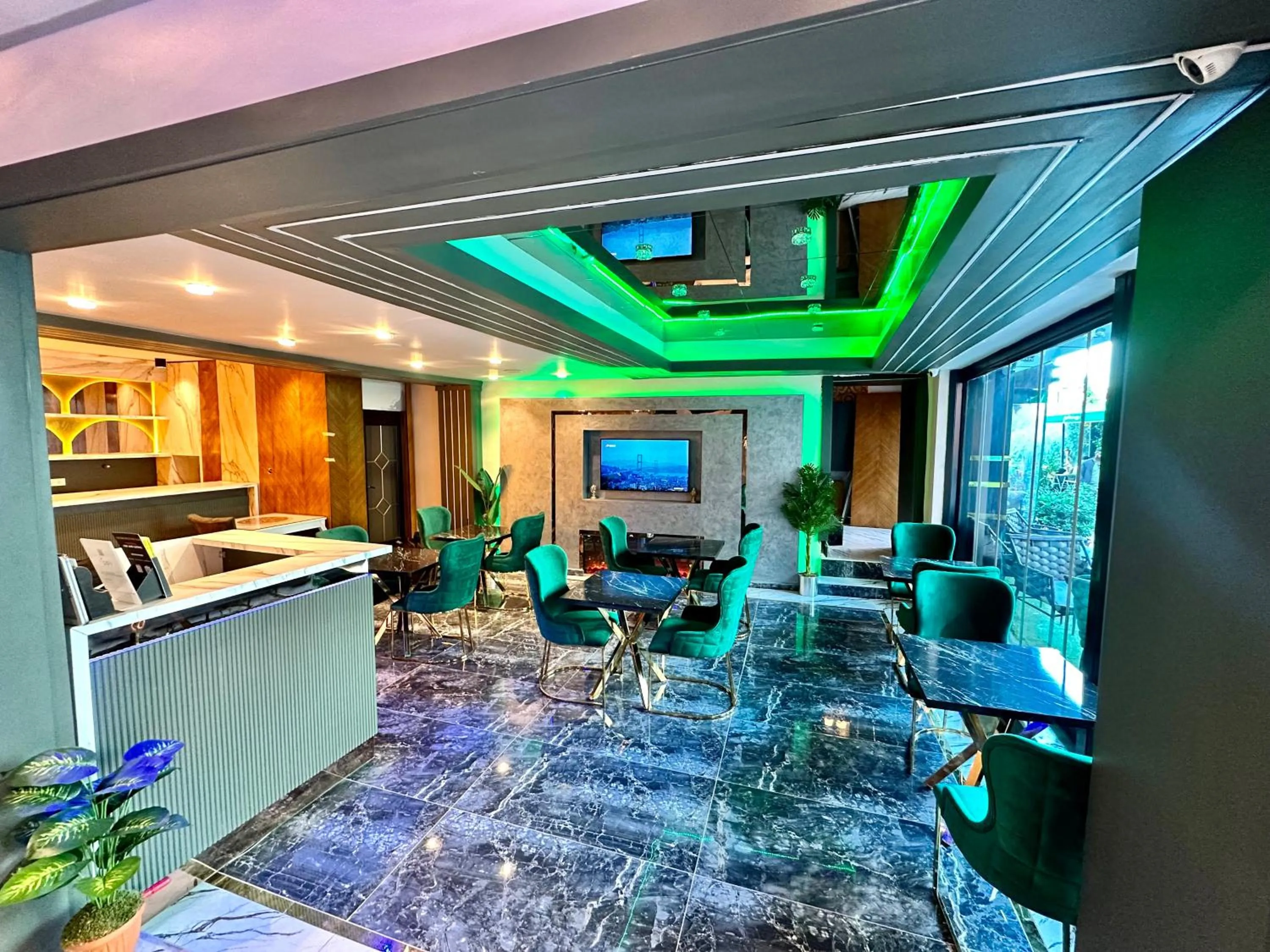 Communal lounge/ TV room in Crowned Plus Hotel