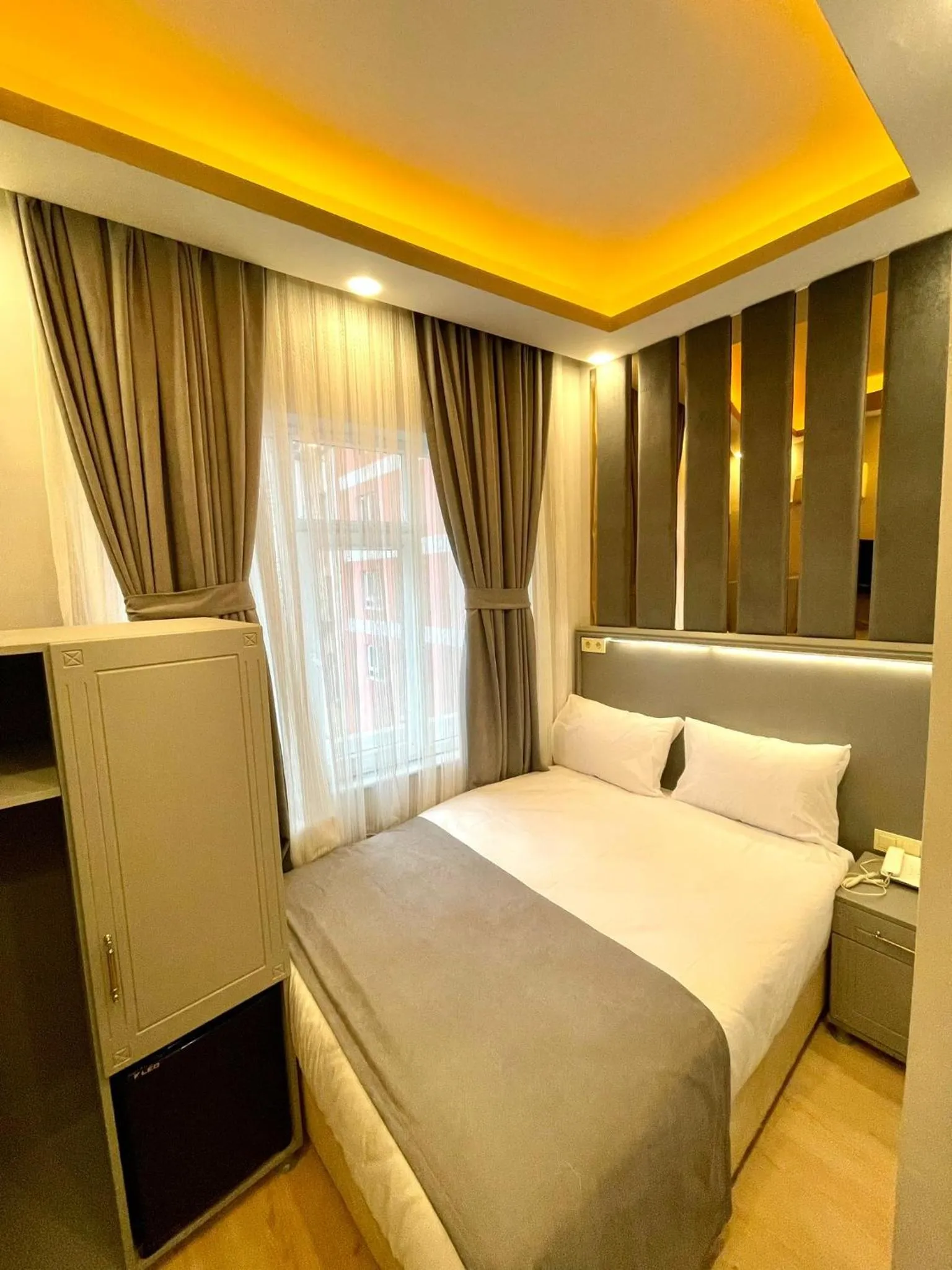 Bed in Crowned Plus Hotel