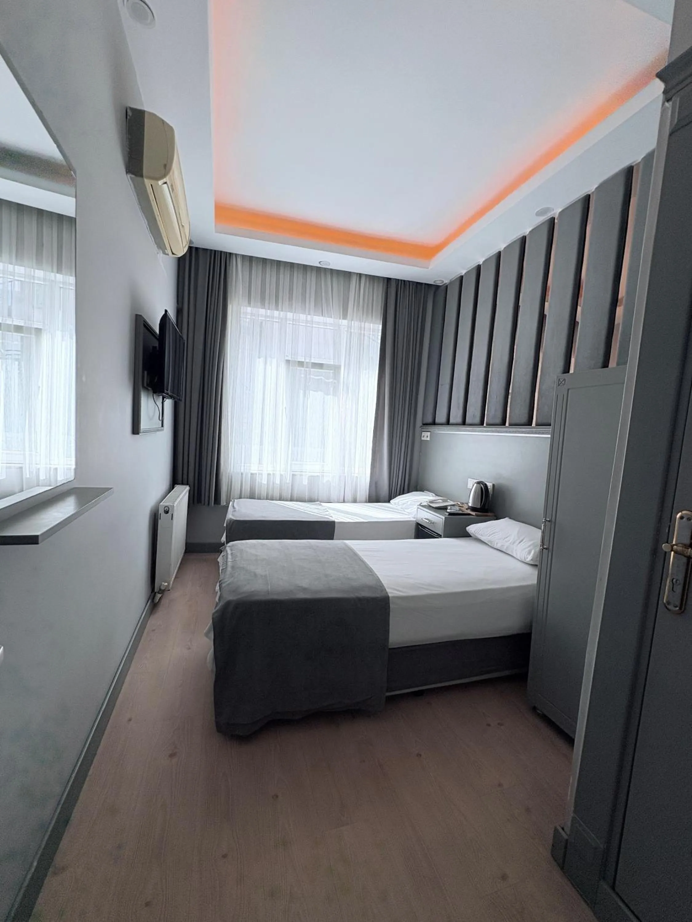 Bed in Crowned Plus Hotel