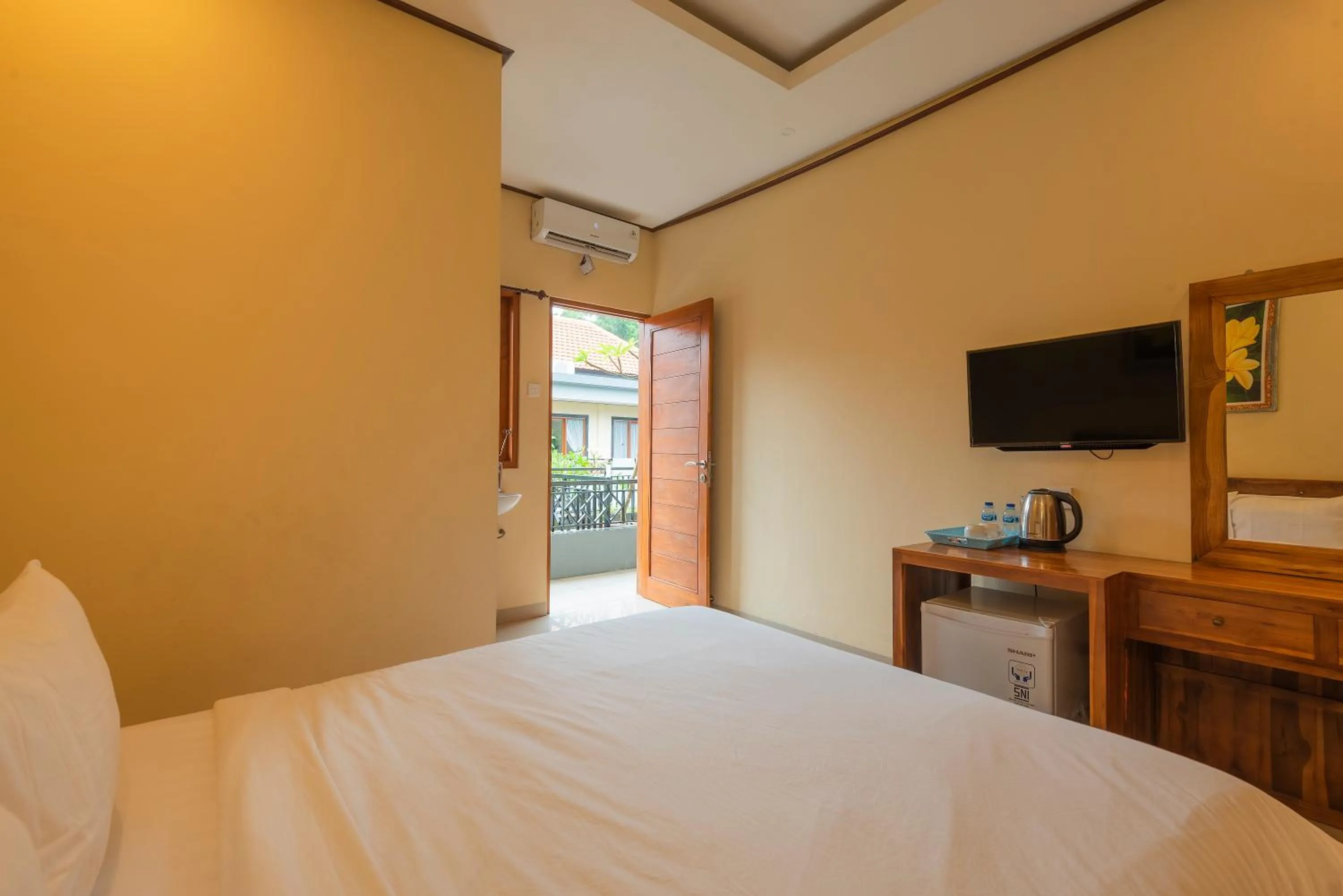 Bed in Liliy Guest House Legian