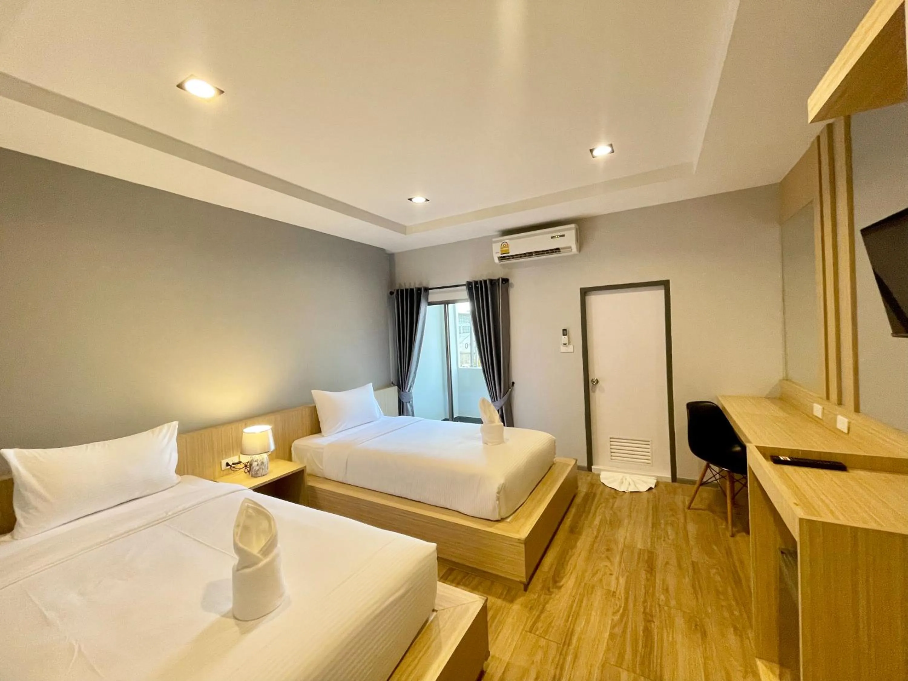 Bed in Klaang Muang Hotel (โรงแรมกลางเมือง)