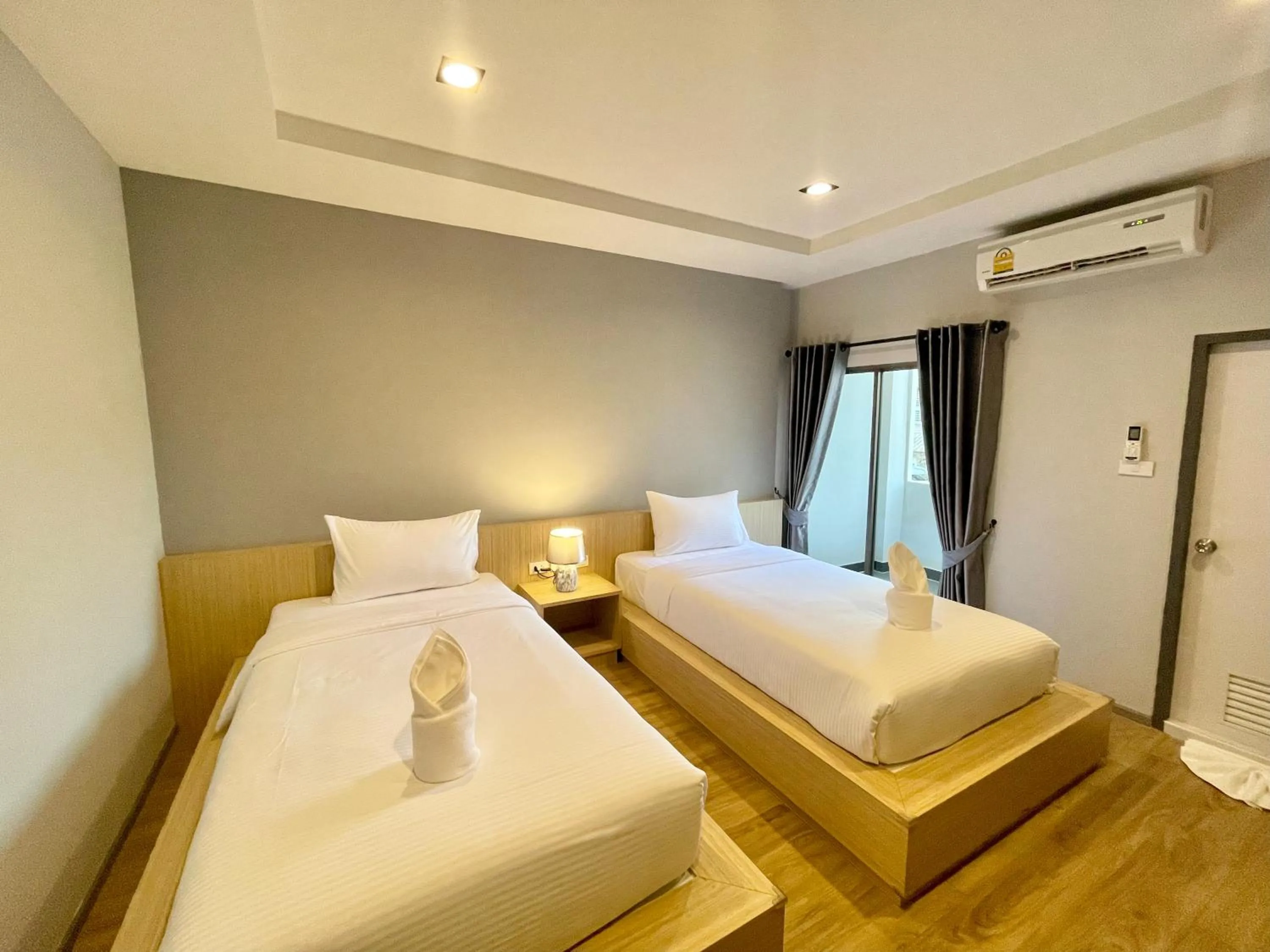 Bed in Klaang Muang Hotel (โรงแรมกลางเมือง)