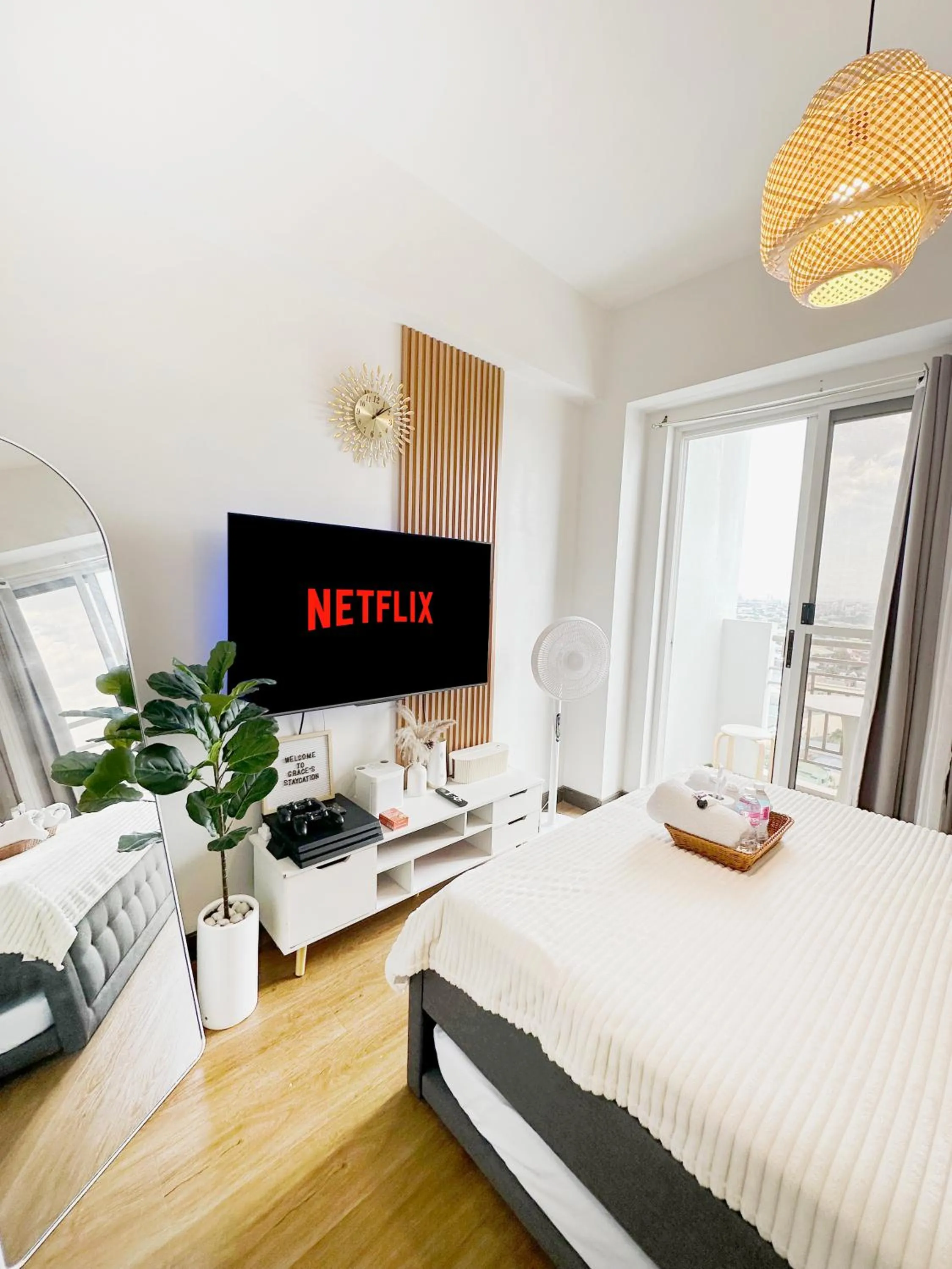 Bed in Zinnia Towers 1BR Condo with PS4 Karaoke Netflix & Swimming Pool