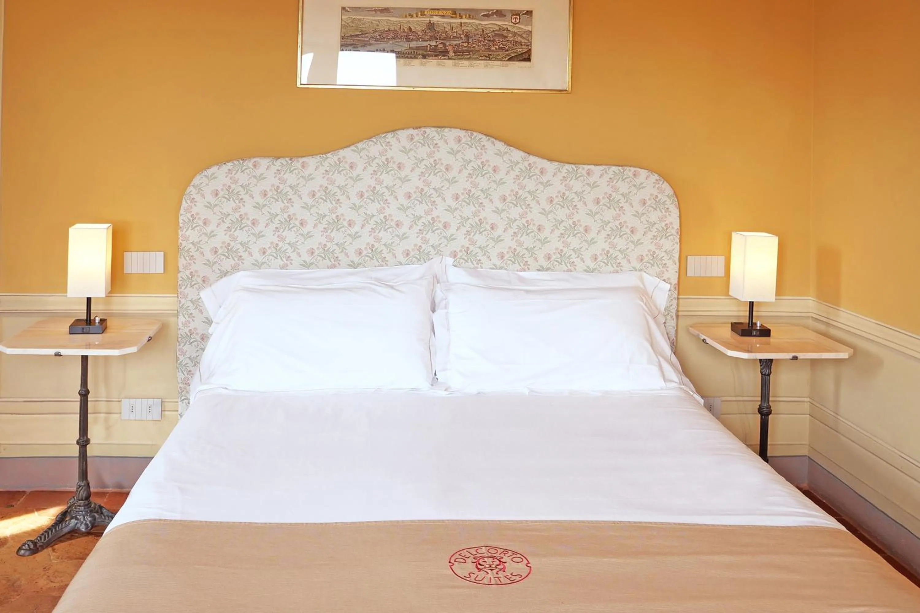 Bed in Delcorto Suites