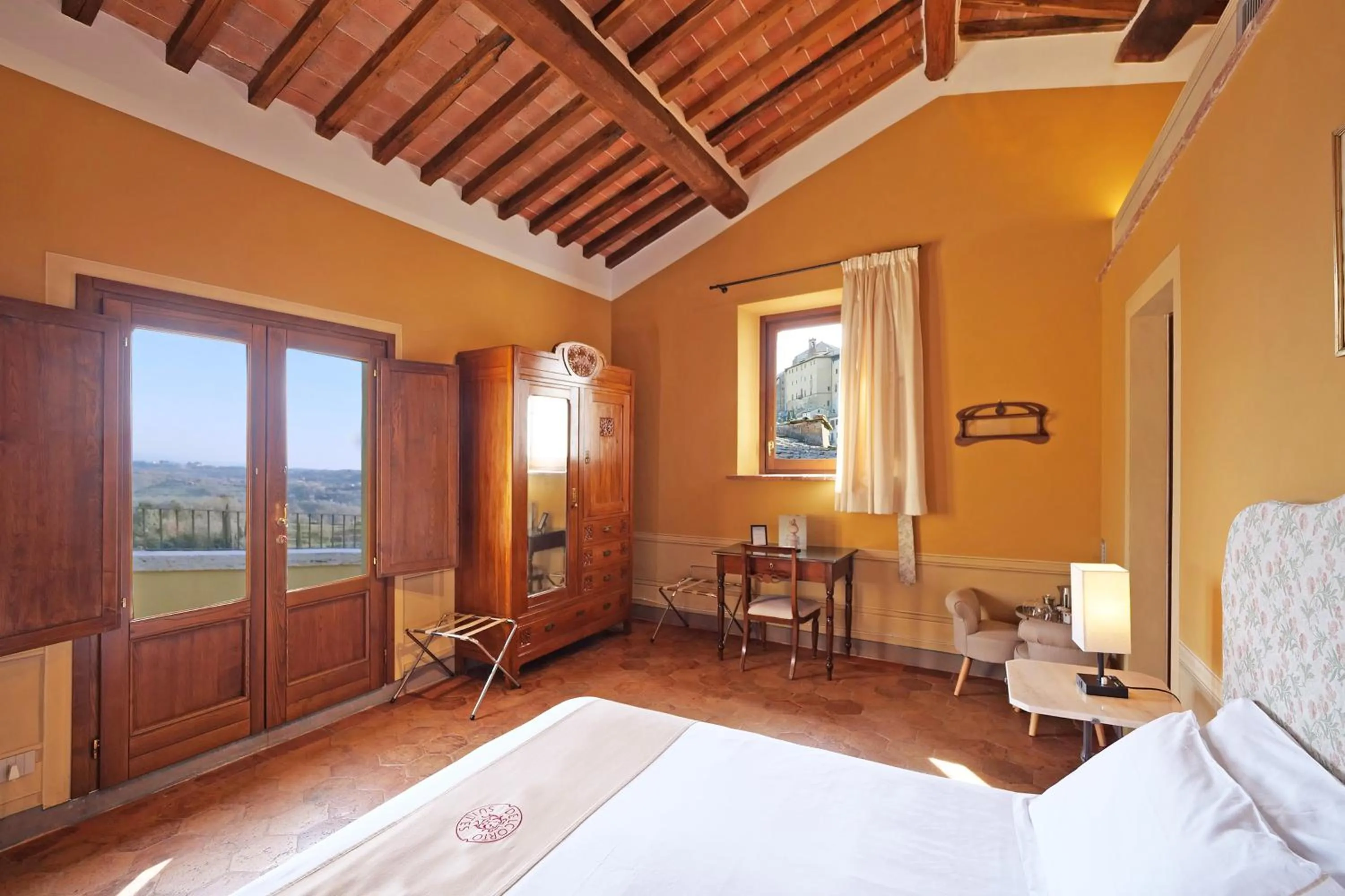 Bed in Delcorto Suites