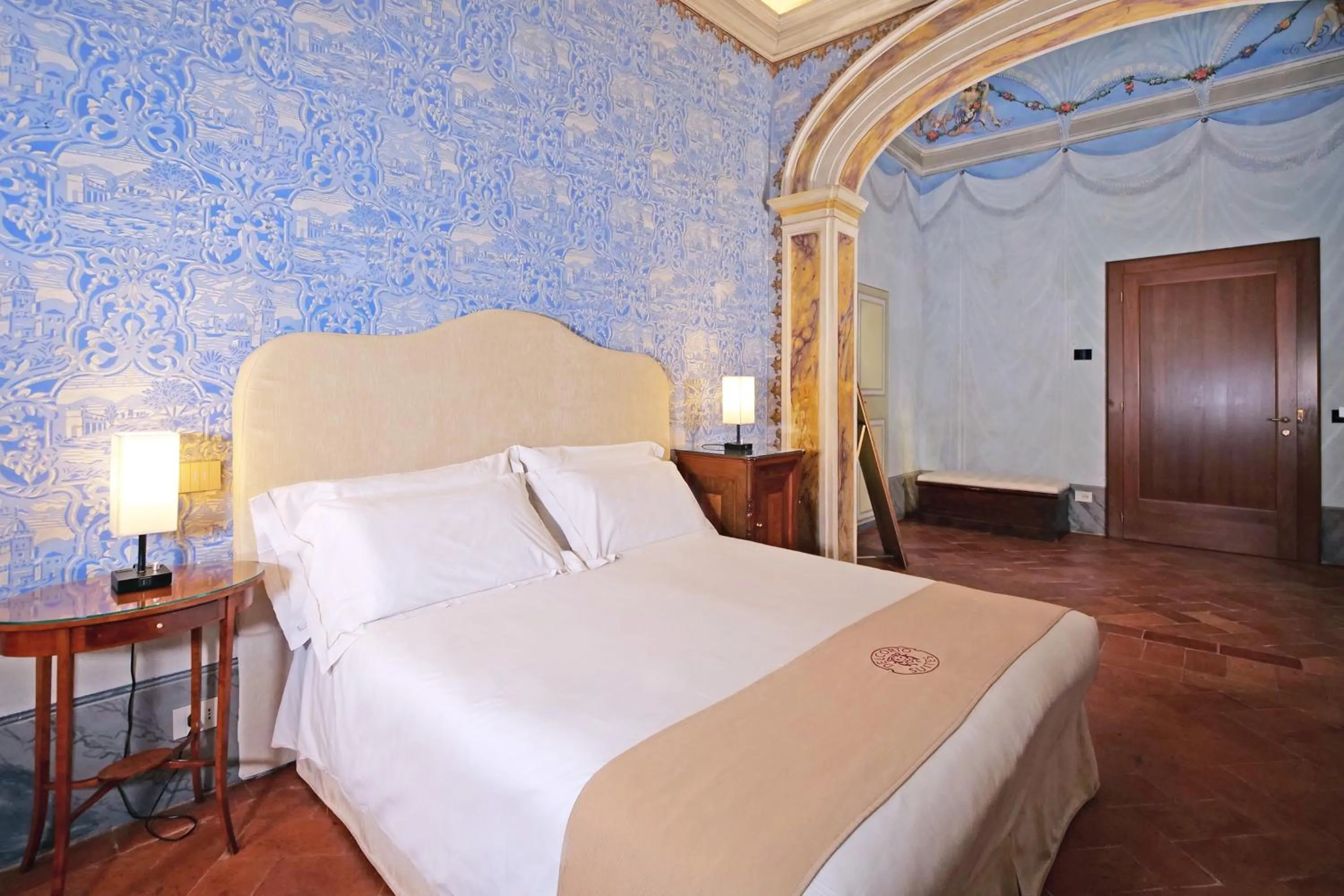 Bed in Delcorto Suites