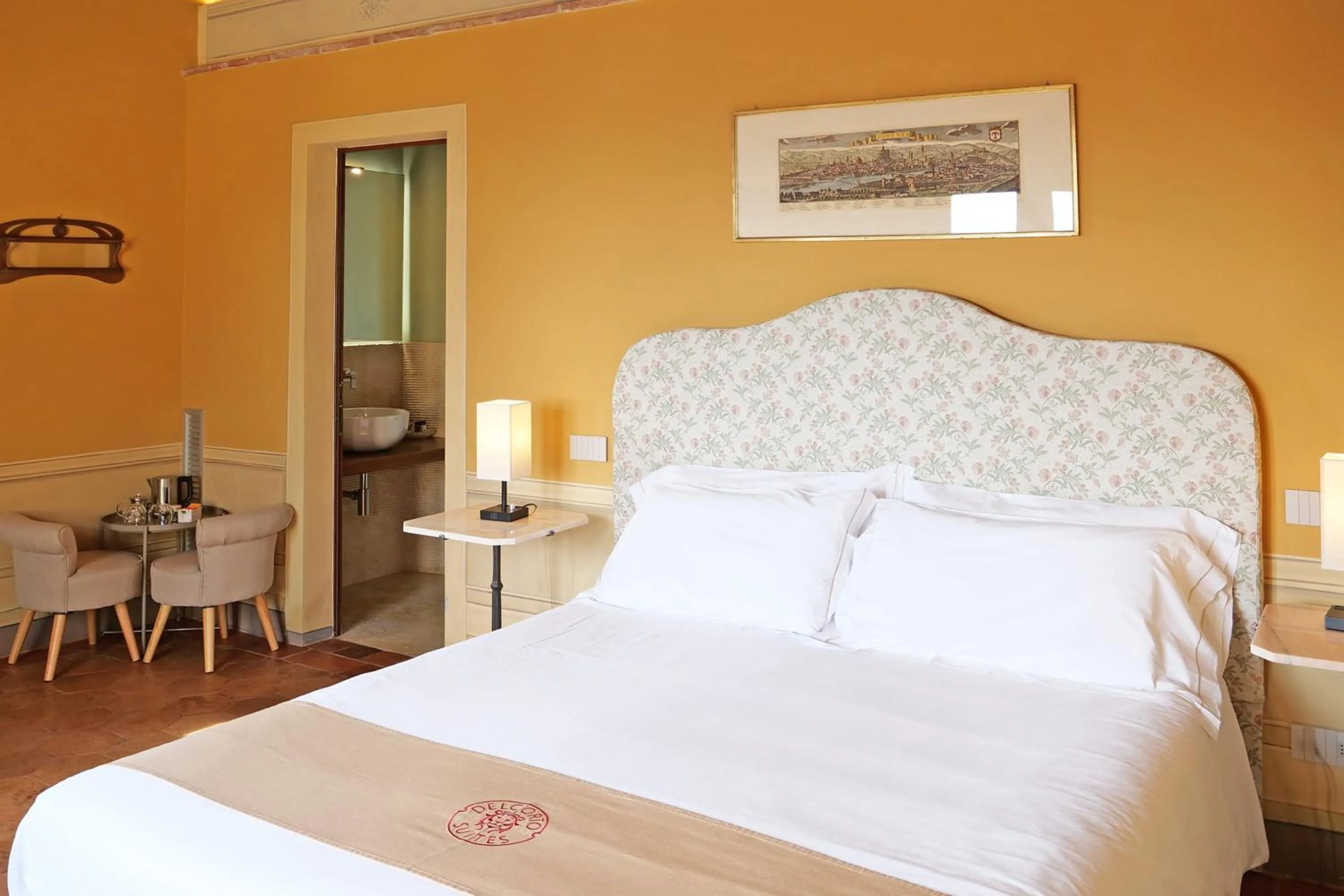 Bed in Delcorto Suites