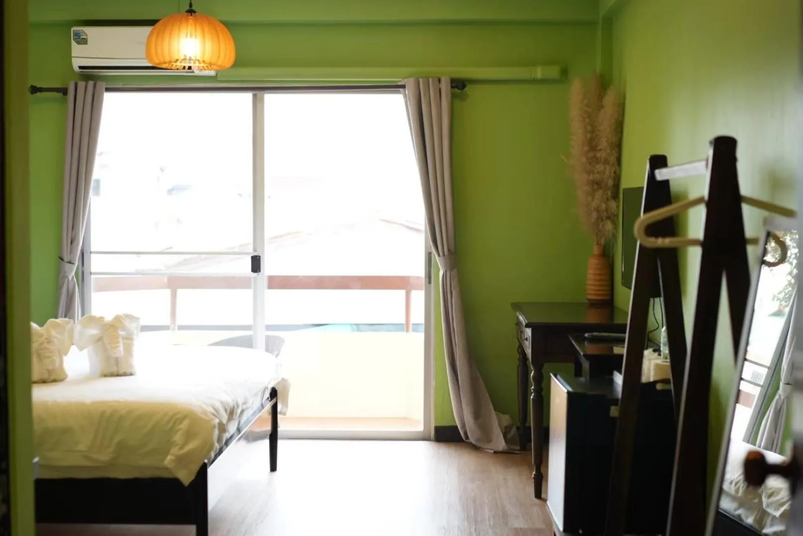 Bed in Elegant Lanna Guesthouse