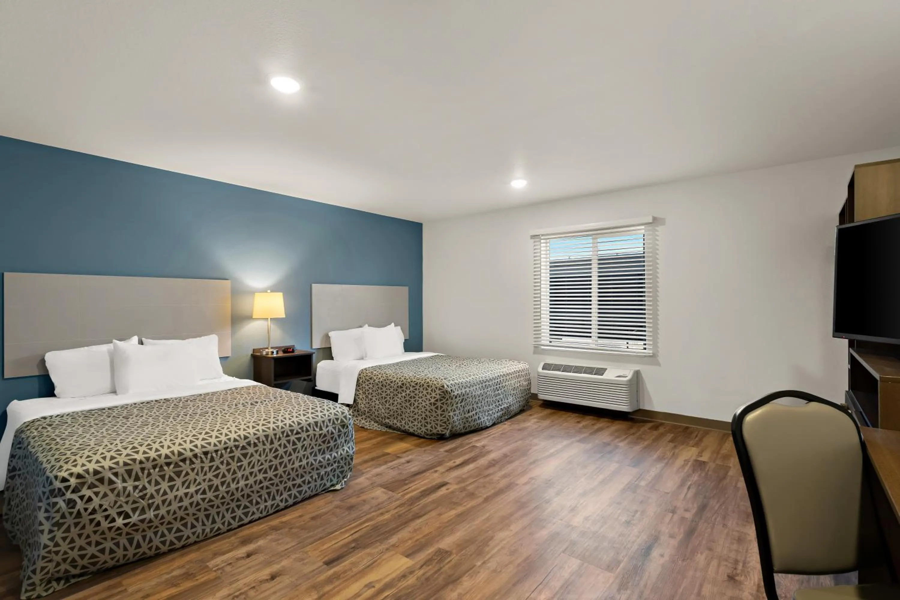 Bedroom, Bed in WoodSpring Suites Fort Collins