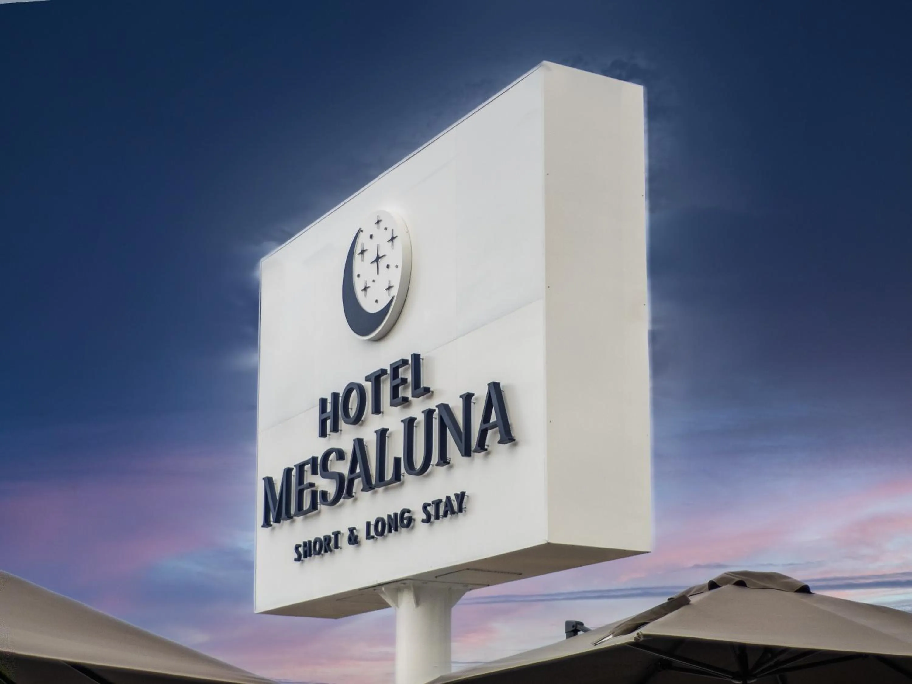 Property logo or sign in Hotel Mesaluna Short & Long Stay