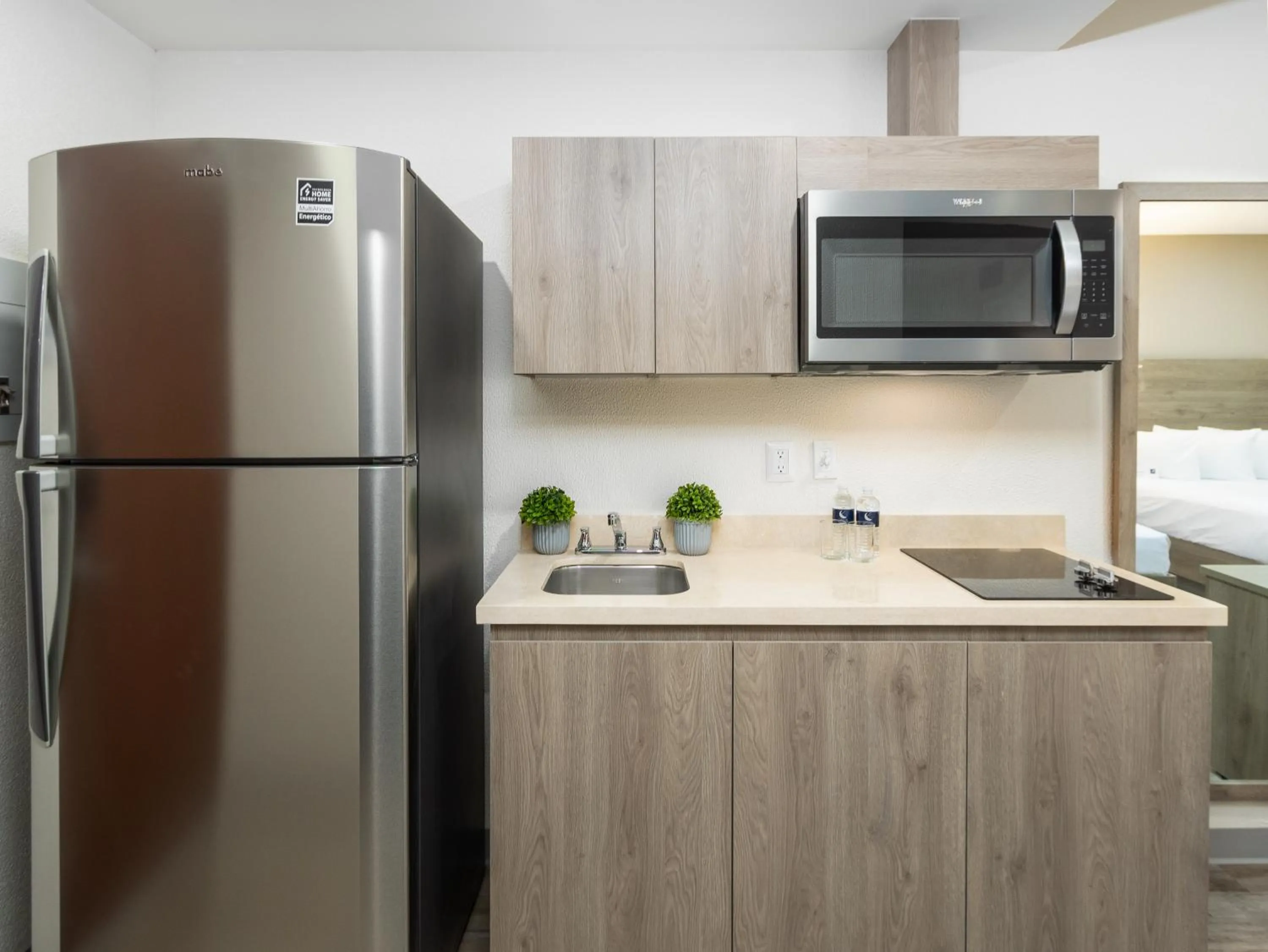 kitchen in Hotel Mesaluna Short & Long Stay