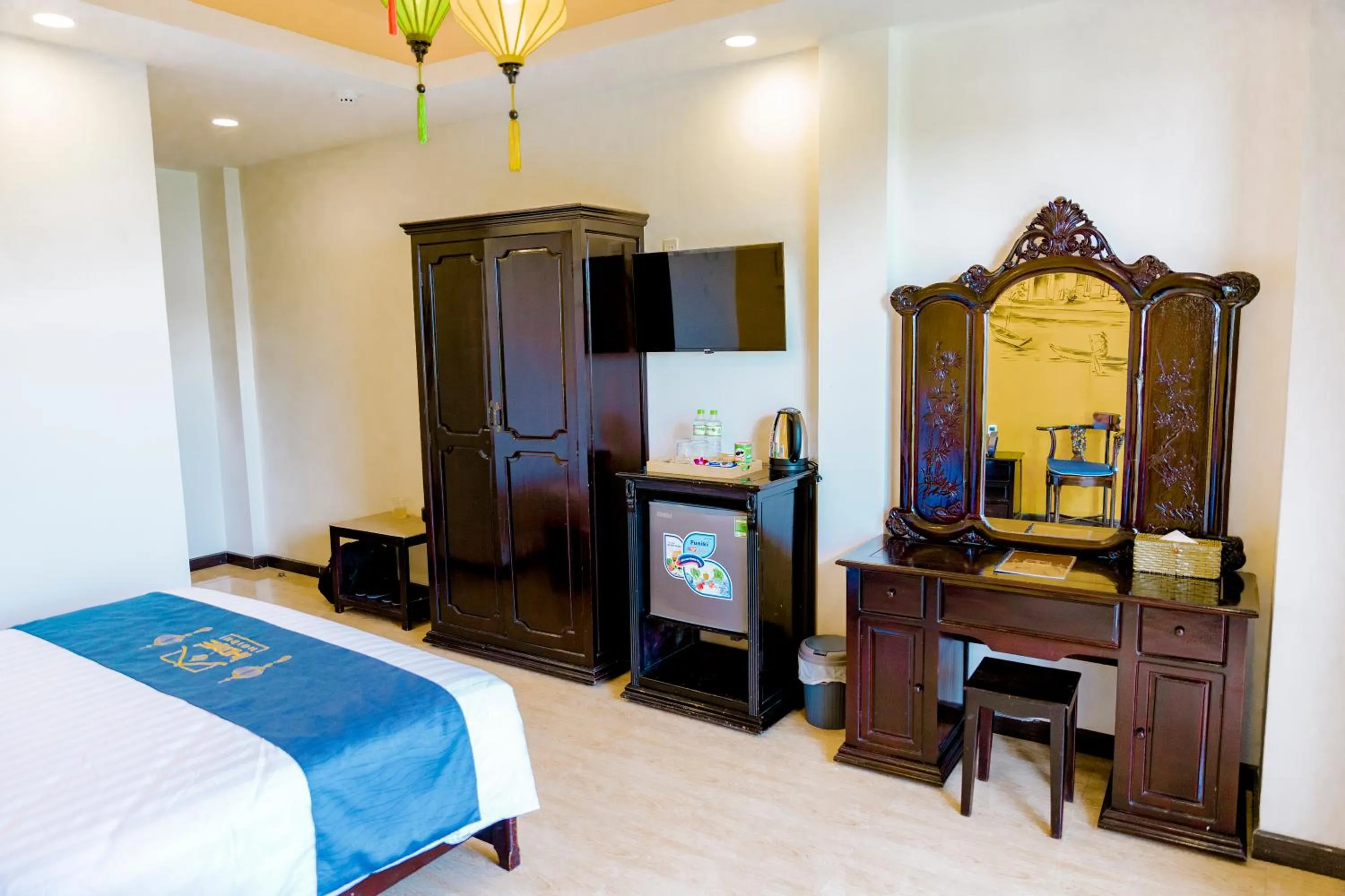 Photo of the whole room, Bed in iHome Hoi An