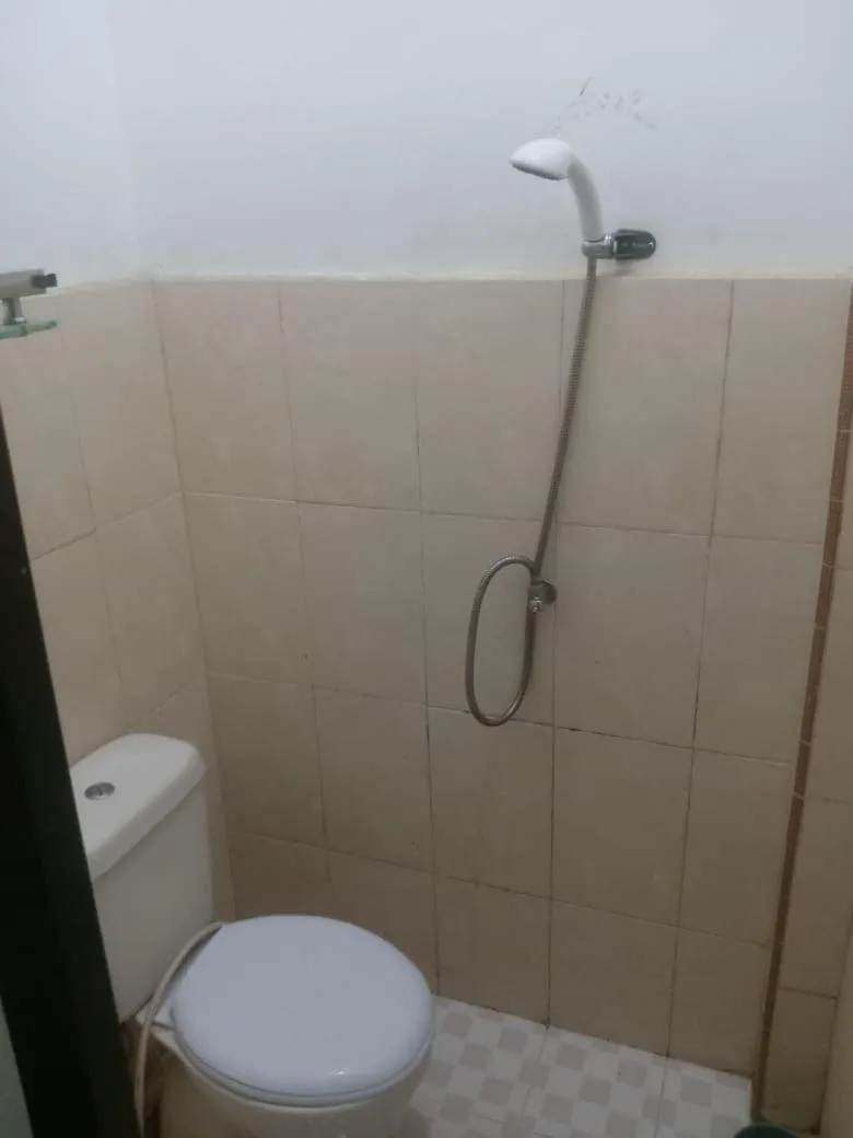 Bathroom in Hotel O Penginapan & Villa Sirait