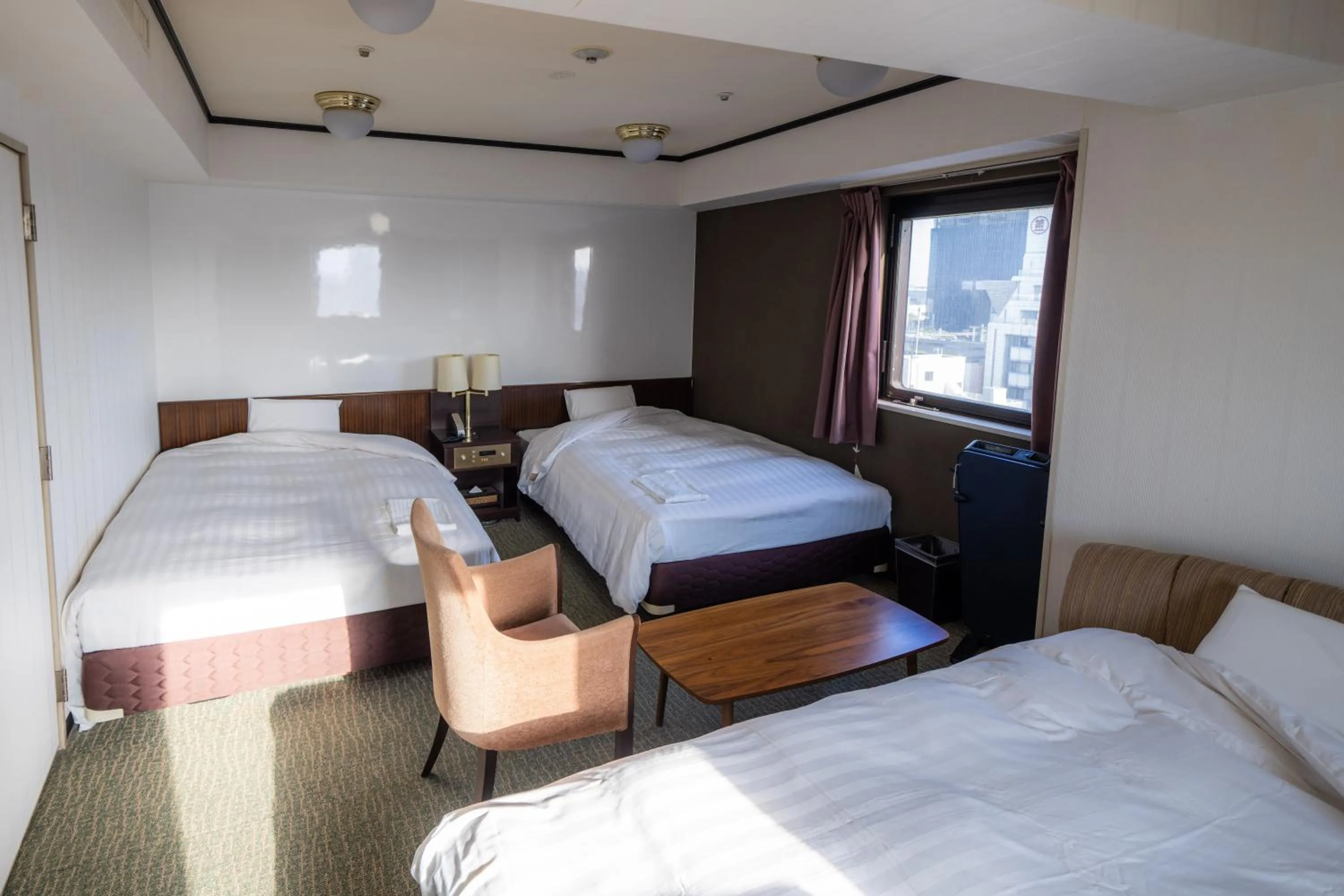 Bed in Ramada Encore by Wyndham Amagasaki