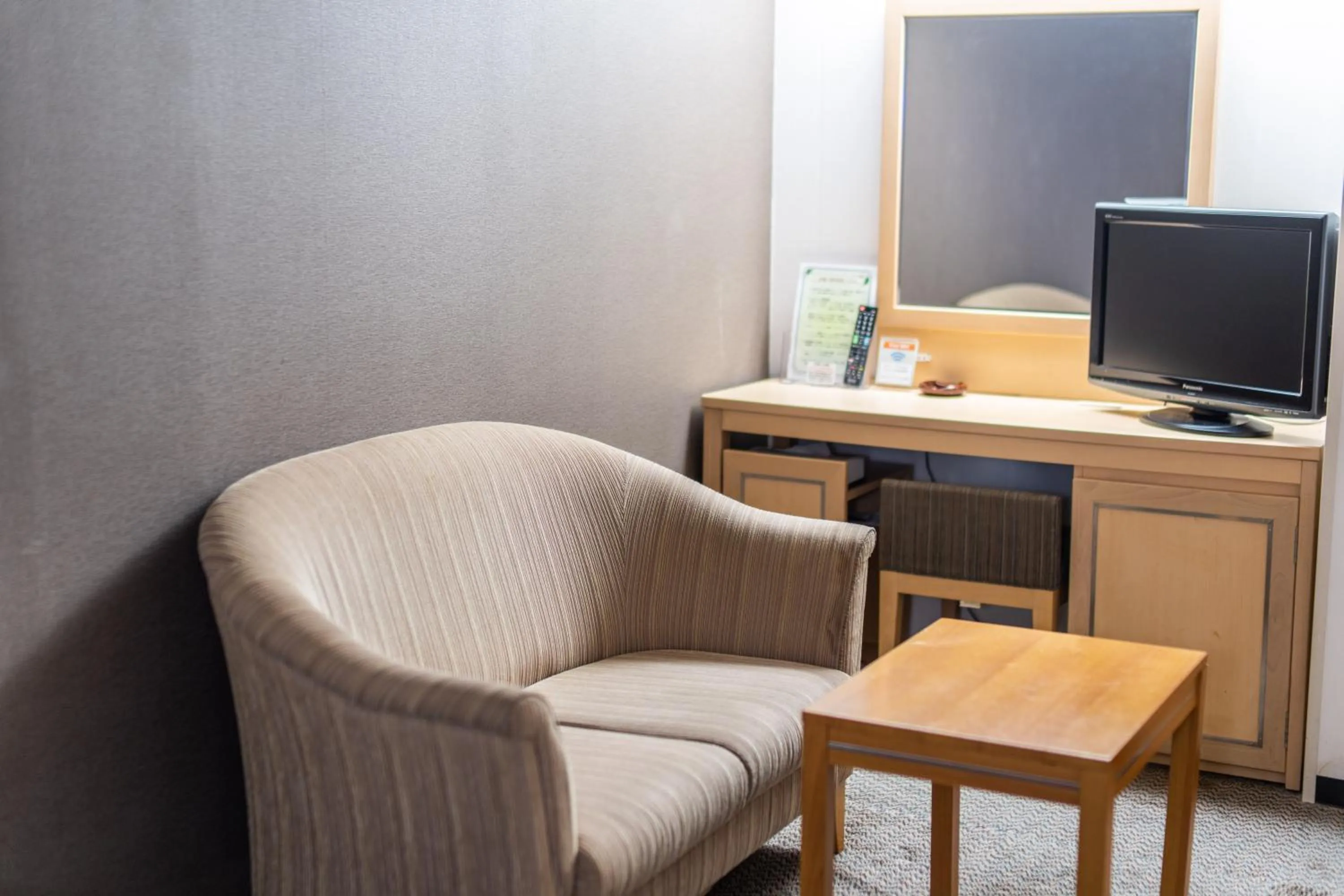 Living room in Ramada Encore by Wyndham Amagasaki