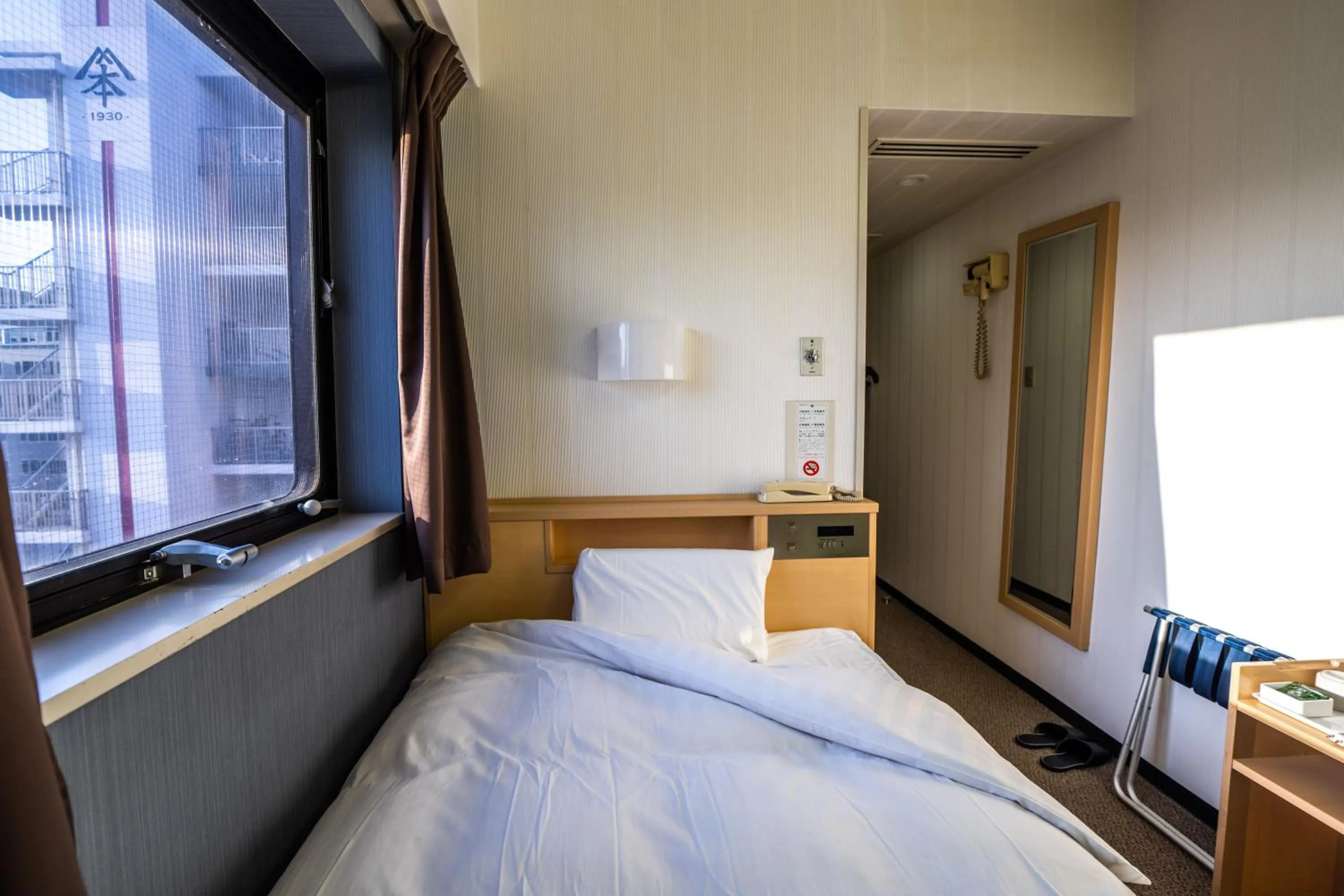 Bed in Ramada Encore by Wyndham Amagasaki