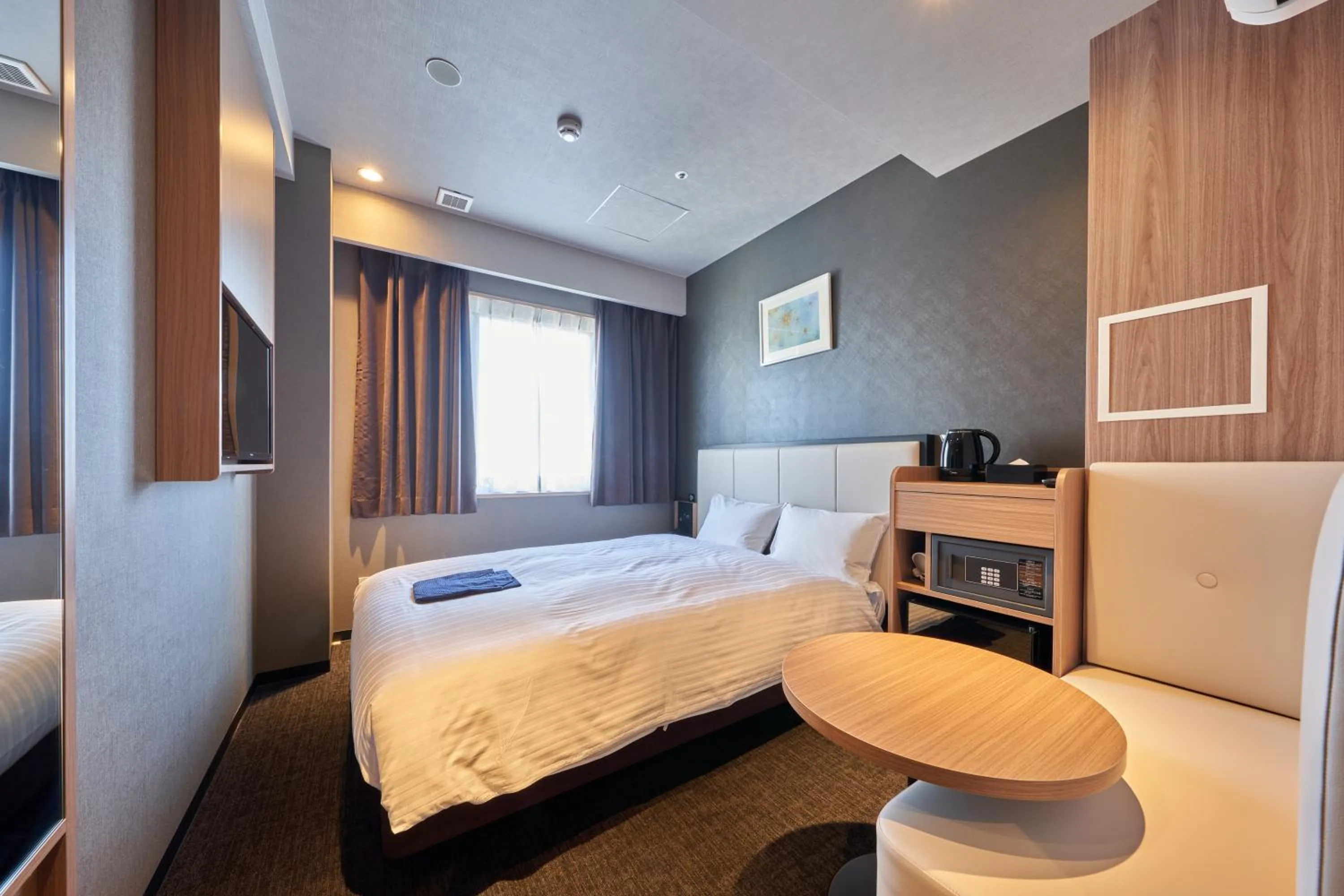 Photo of the whole room, Bed in Welina Hotel Premier Nakanoshima West