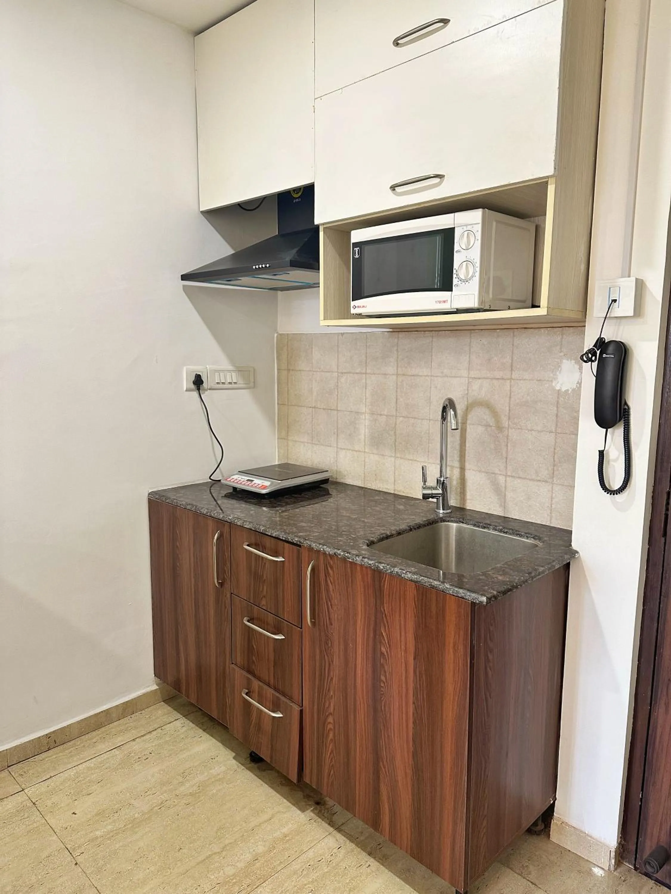 Kitchen or kitchenette in Flamingo Hotel Sector 67 I Studio Rooms I Gurgaon