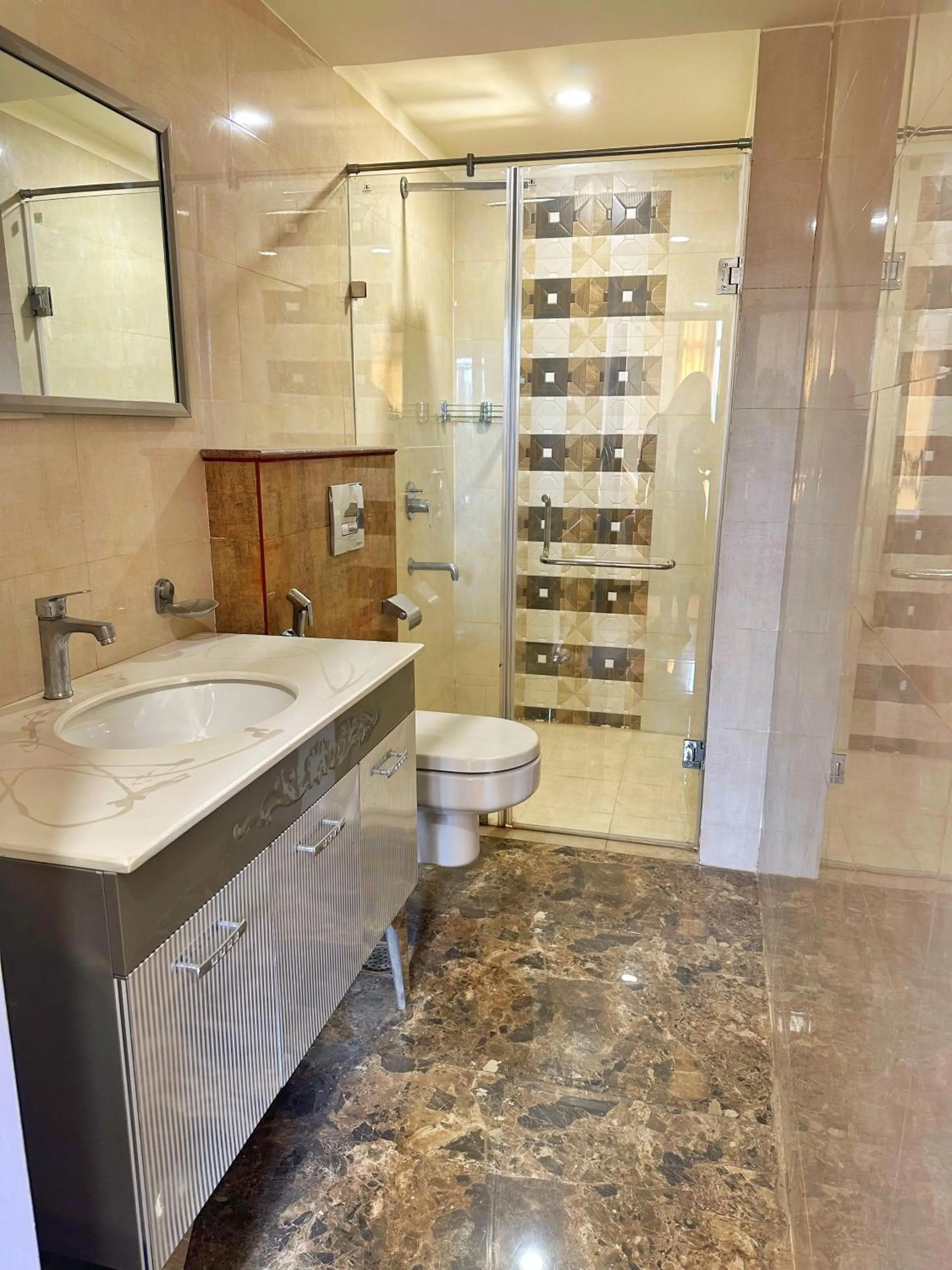 Shower in Flamingo Hotel Sector 67 I Studio Rooms I Gurgaon