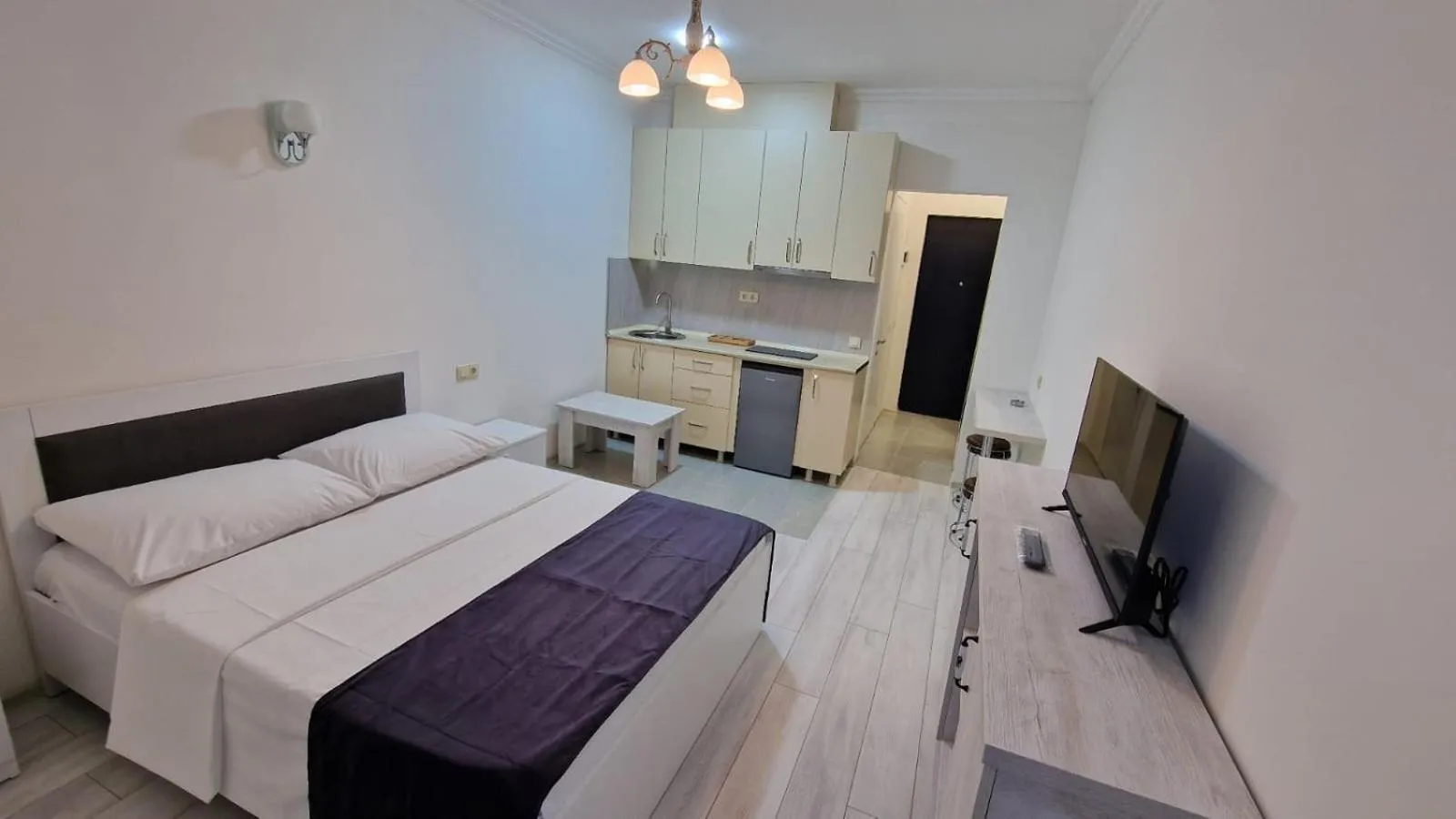 Communal lounge/ TV room, Bed in Salami Residence