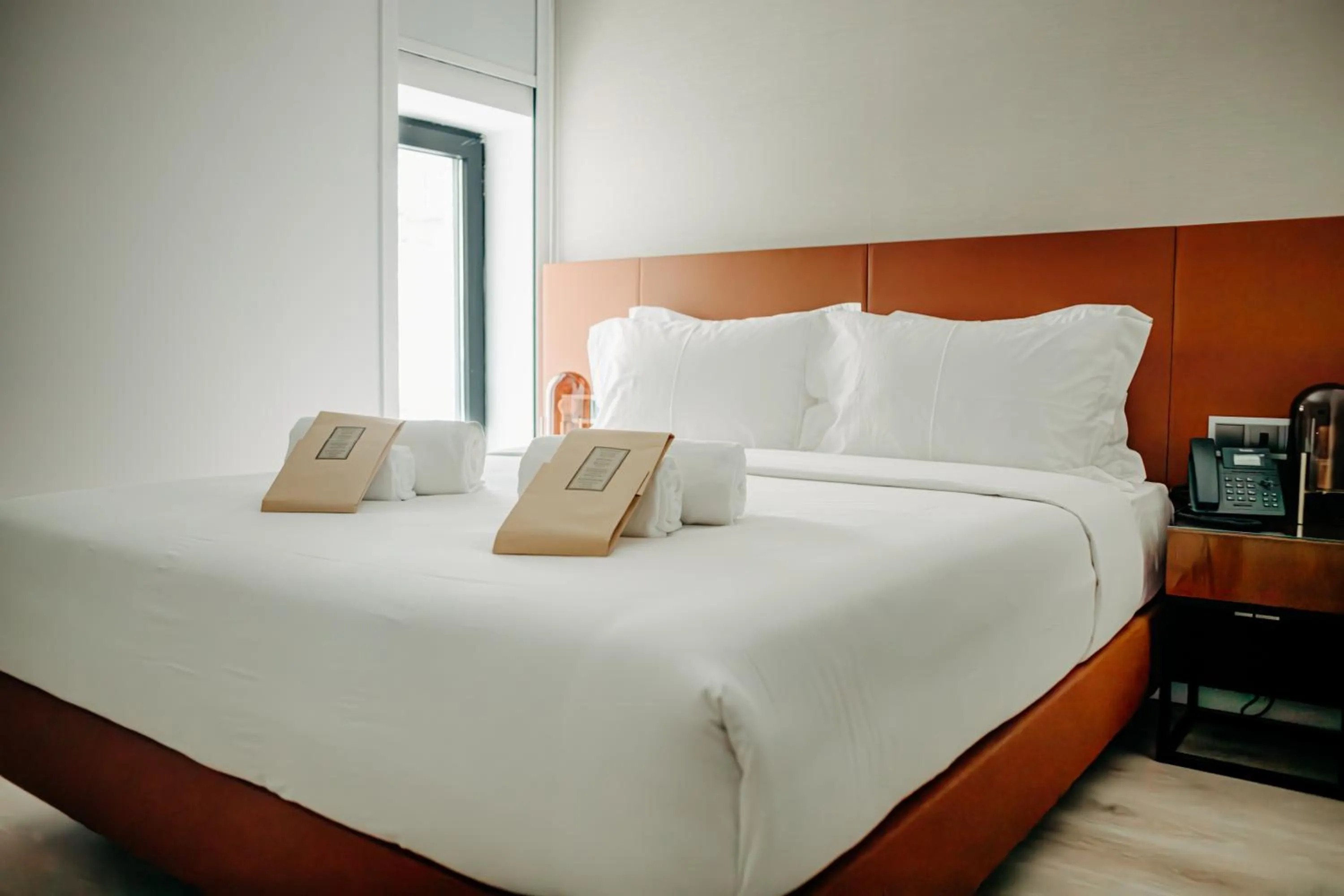 Bed in Next Level Premium Hotels
