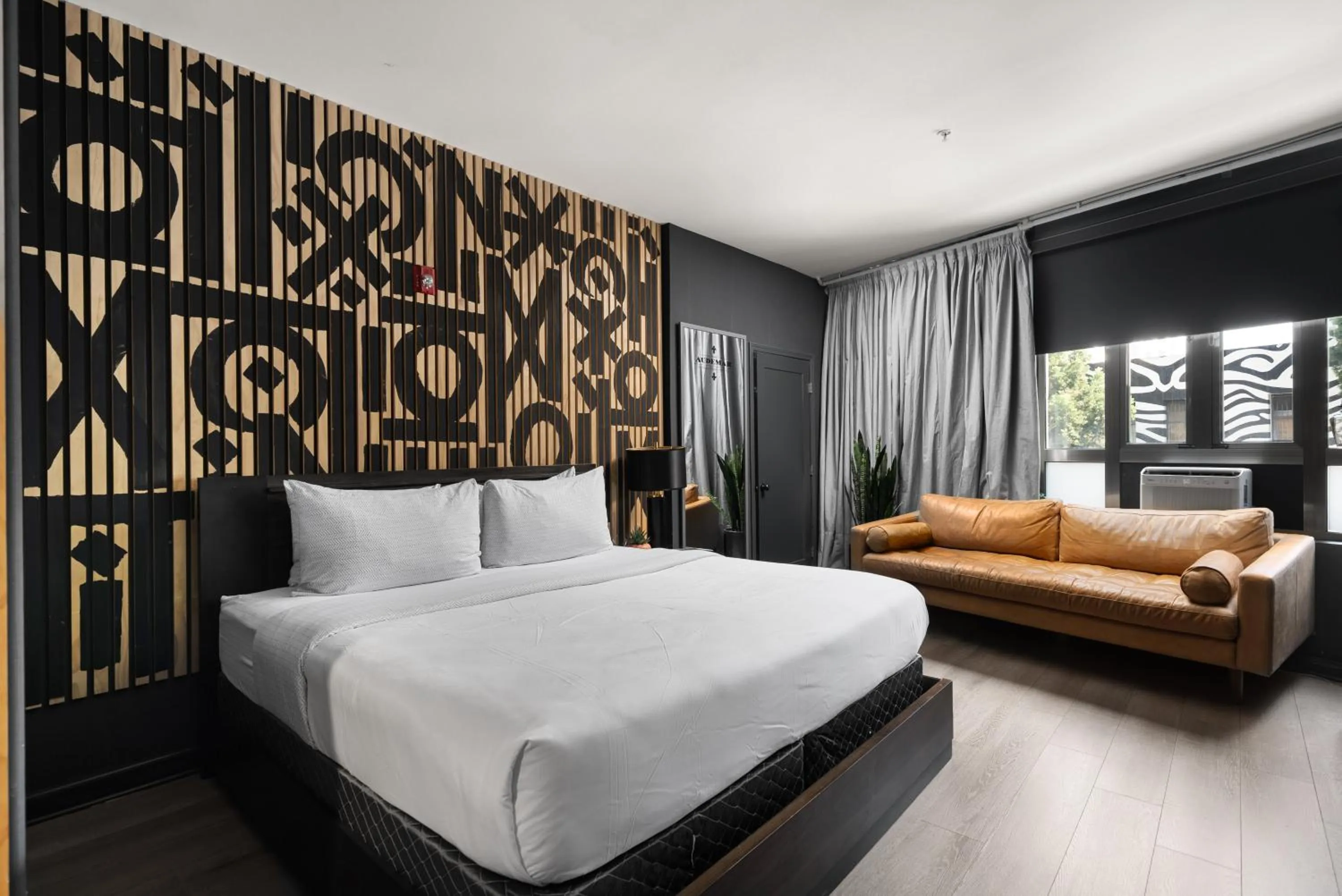 Bed in Audemar Boutique Hotel and Apartment Homes