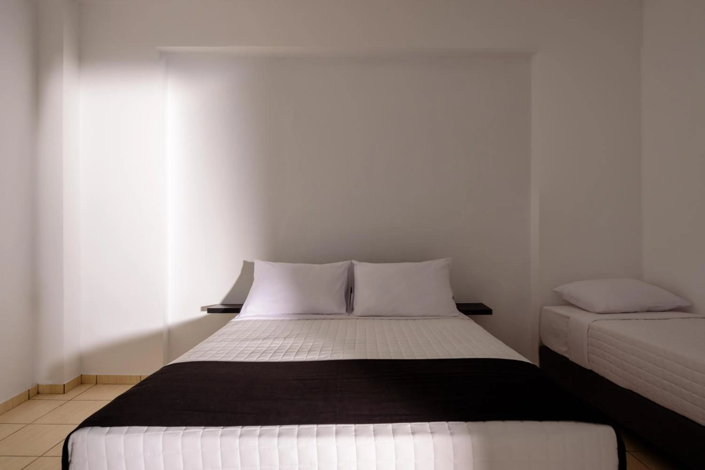 Quadruple Room with Garden View in Tataki Family Hotel